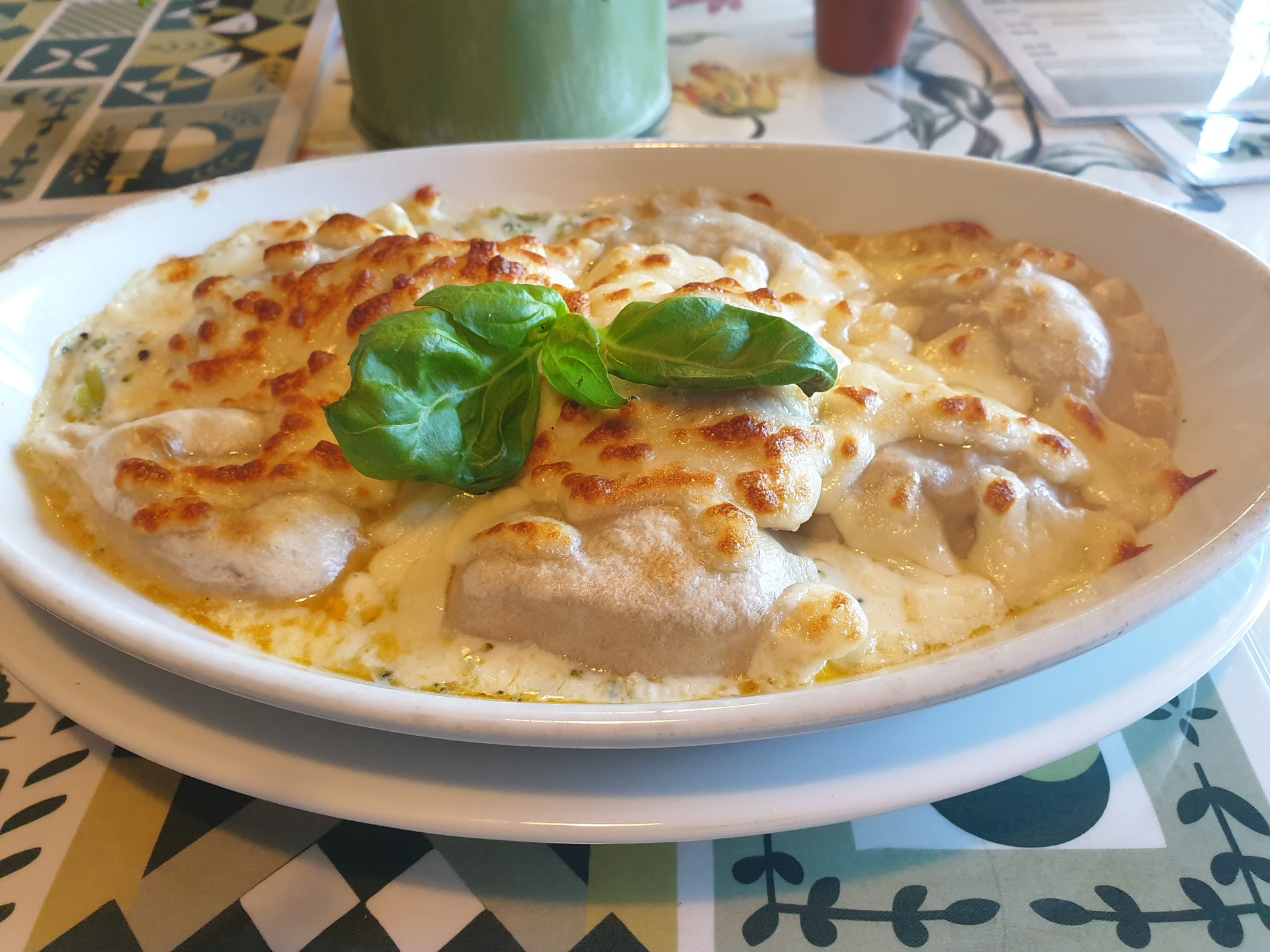 Overhead flat-lay of all ingredients for Chicken Florentine with Creamy Garlic Sauce laid out on a kitchen surface.
