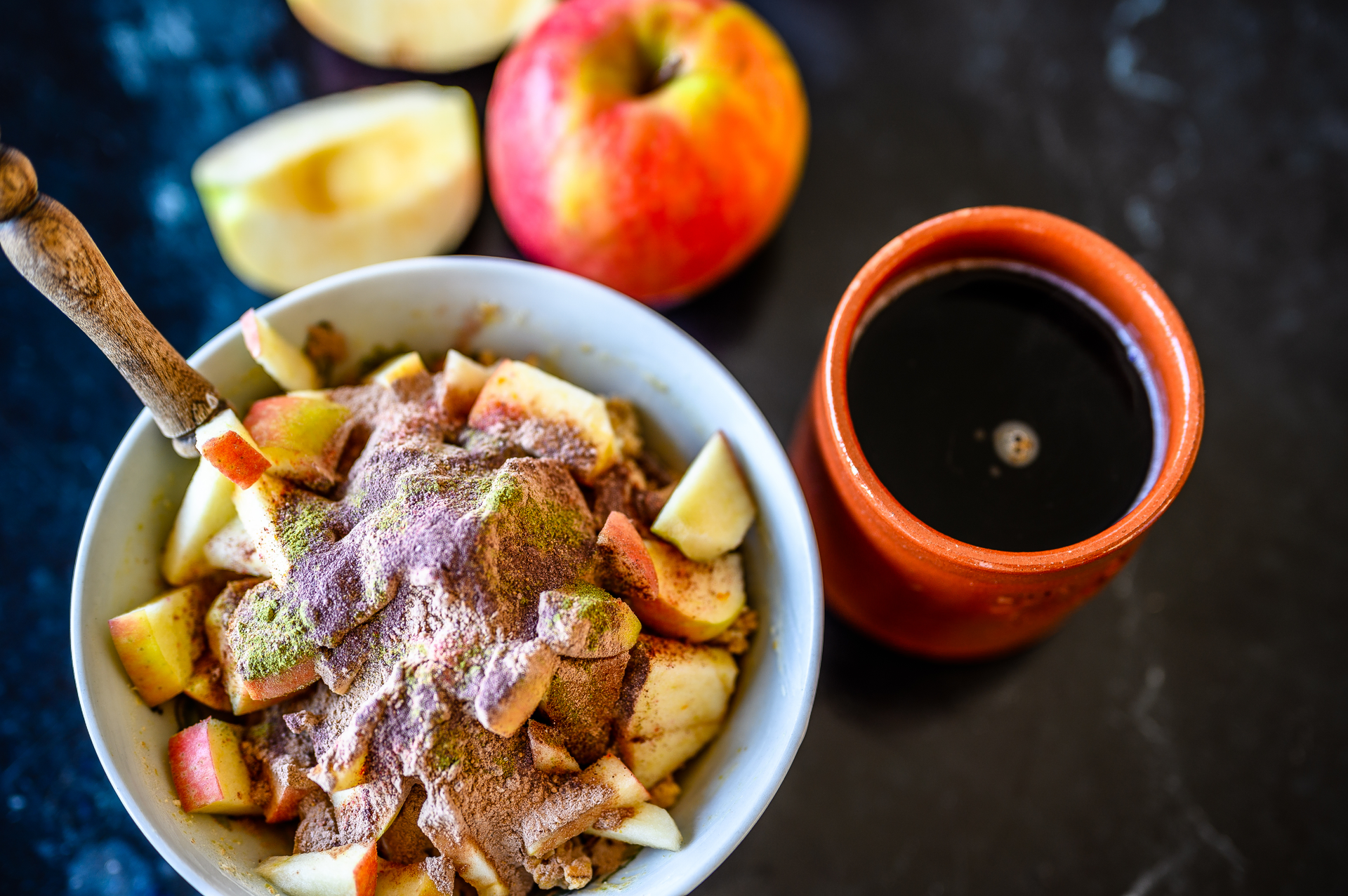 Overhead flat-lay of all ingredients for Chilean Merquén-Brined Roast Pork with Apple Compote laid out on a kitchen surface.