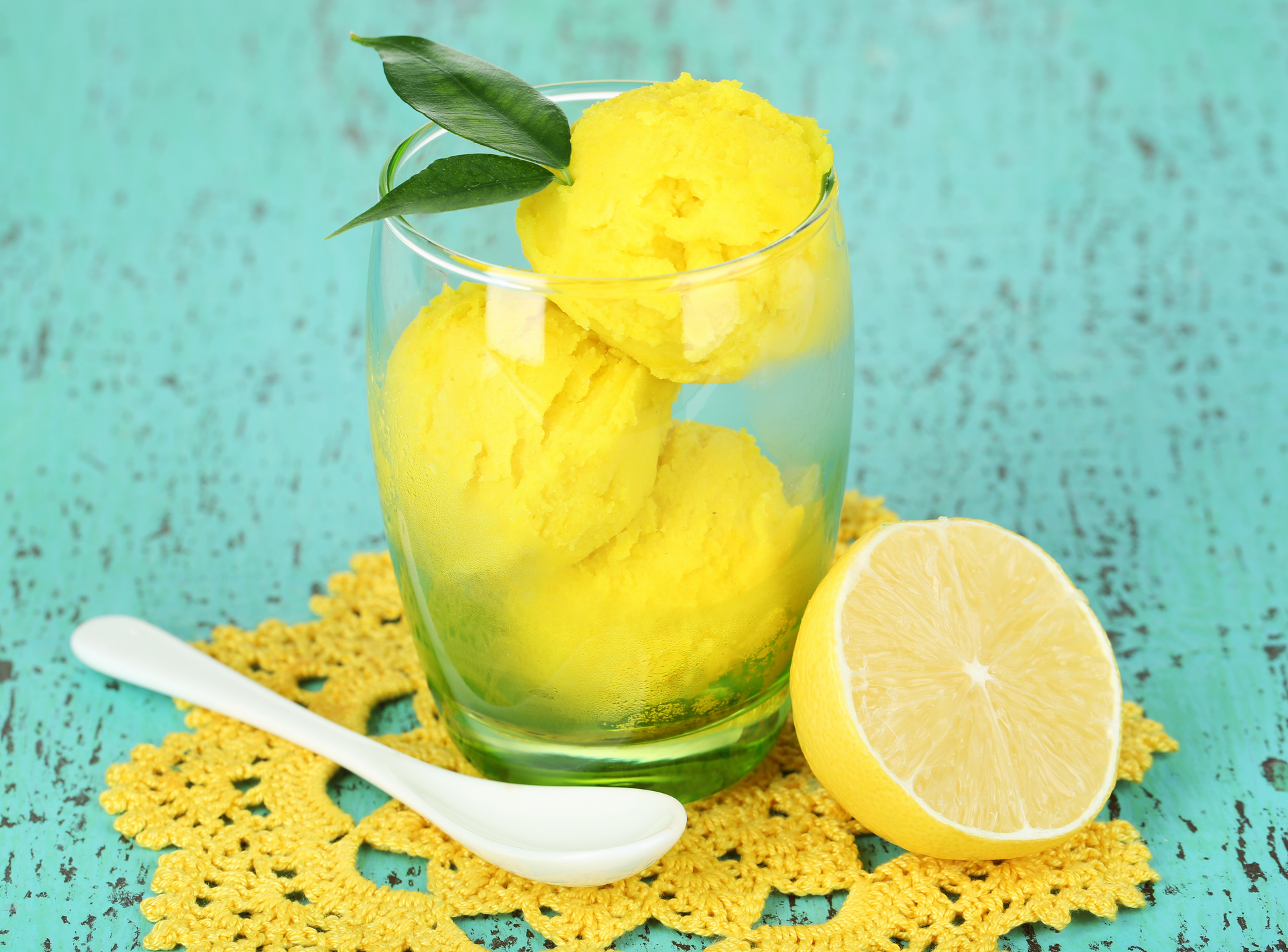 Overhead flat-lay of all ingredients for Chilled Sicilian Citrus Granita with Fresh Mint and Pistachio Dust laid out on a kitchen surface.