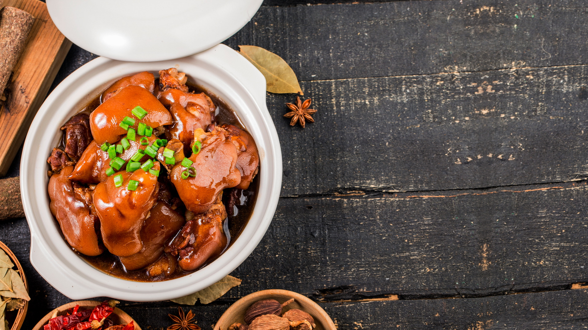 Overhead flat-lay of all ingredients for Chinese Drunken Chicken with Shaoxing Wine laid out on a kitchen surface.