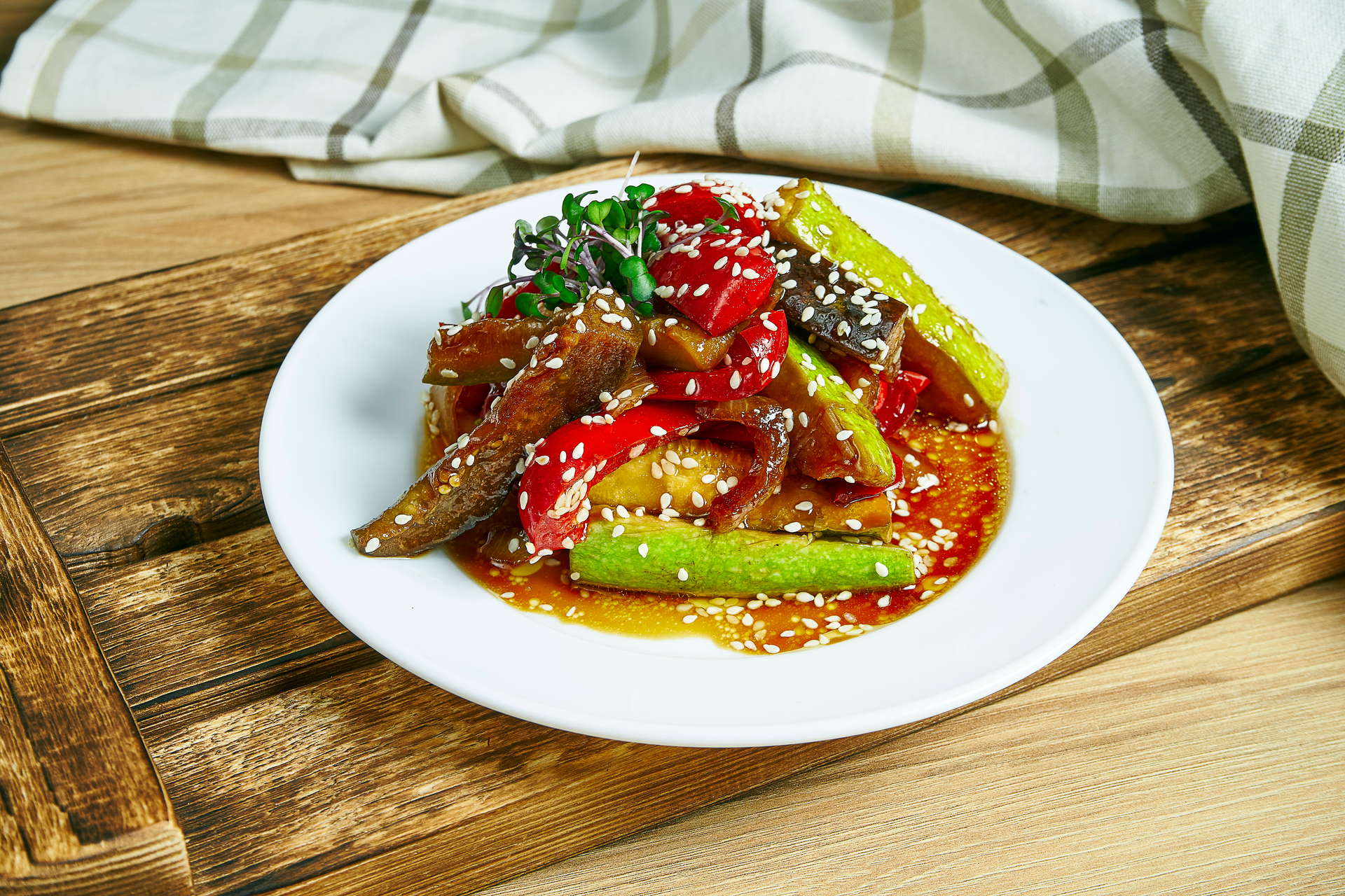 Overhead flat-lay of all ingredients for Chinese Pork and Cucumber Stir Fry with Sesame Oil laid out on a kitchen surface.
