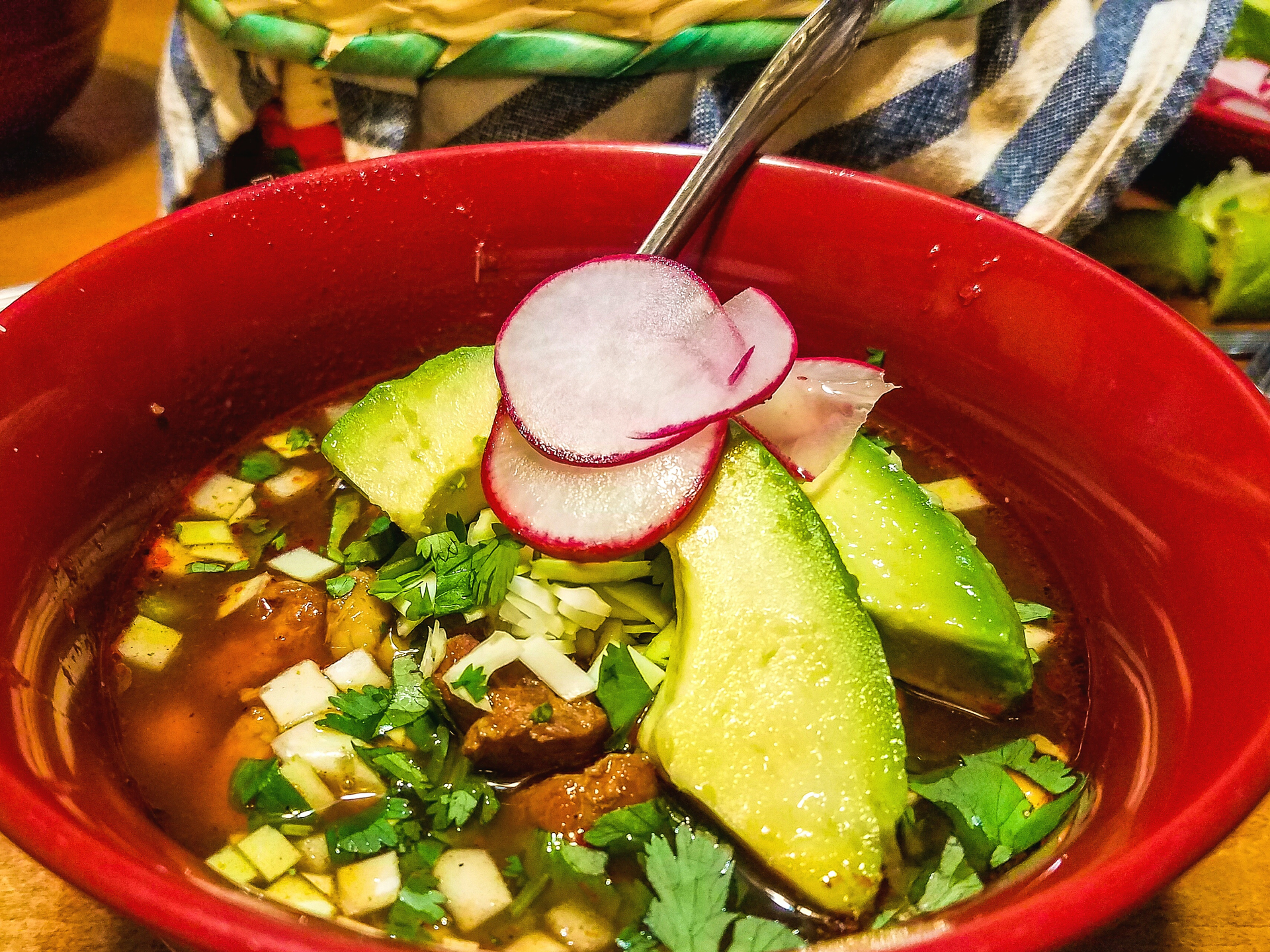 Colombian Ajiaco Bogotano with Crispy Capers and Avocado — Main Course served and photographed from above