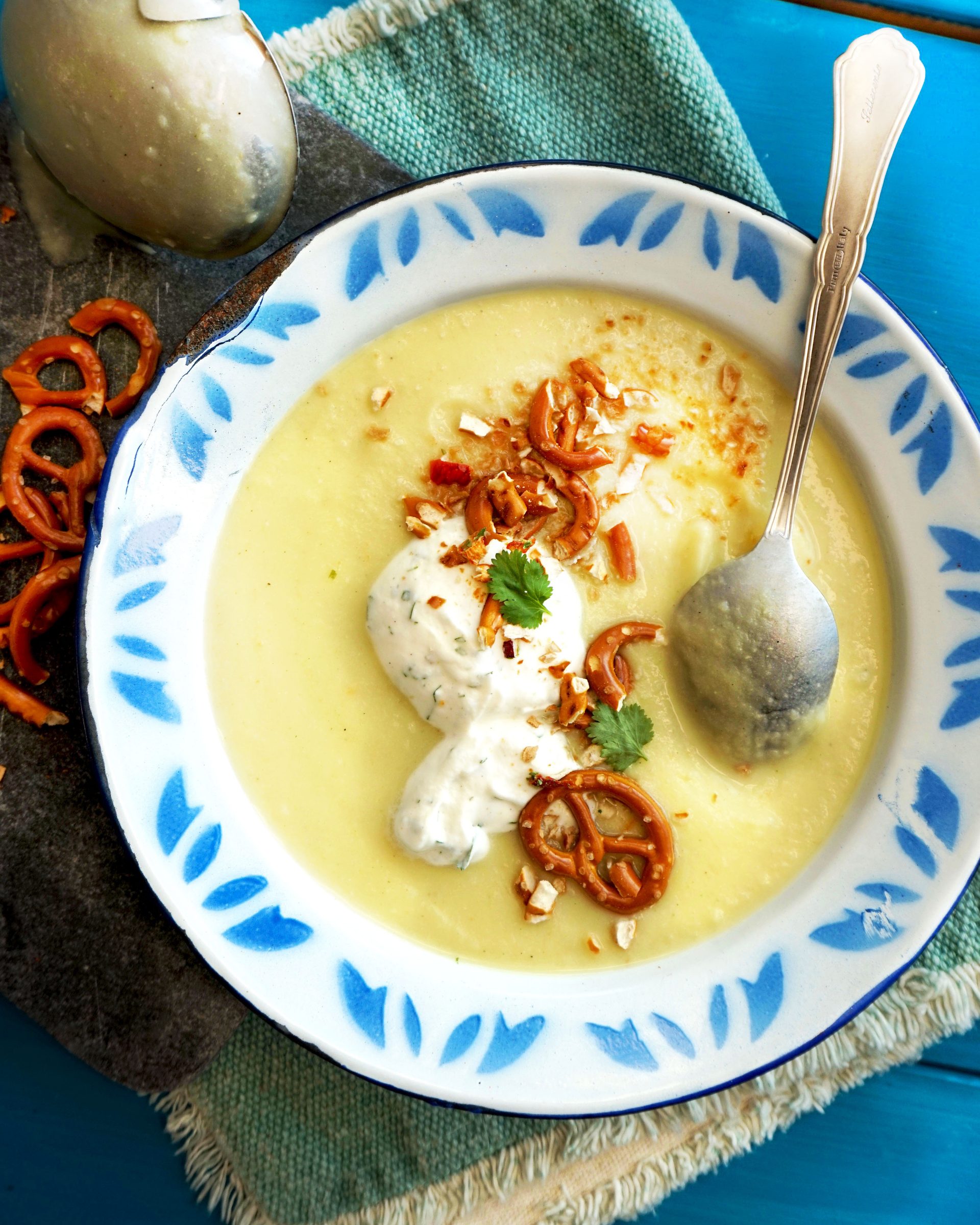 Overhead flat-lay of all ingredients for Creamy Bhutanese Ema Datshi with Yak Cheese laid out on a kitchen surface.