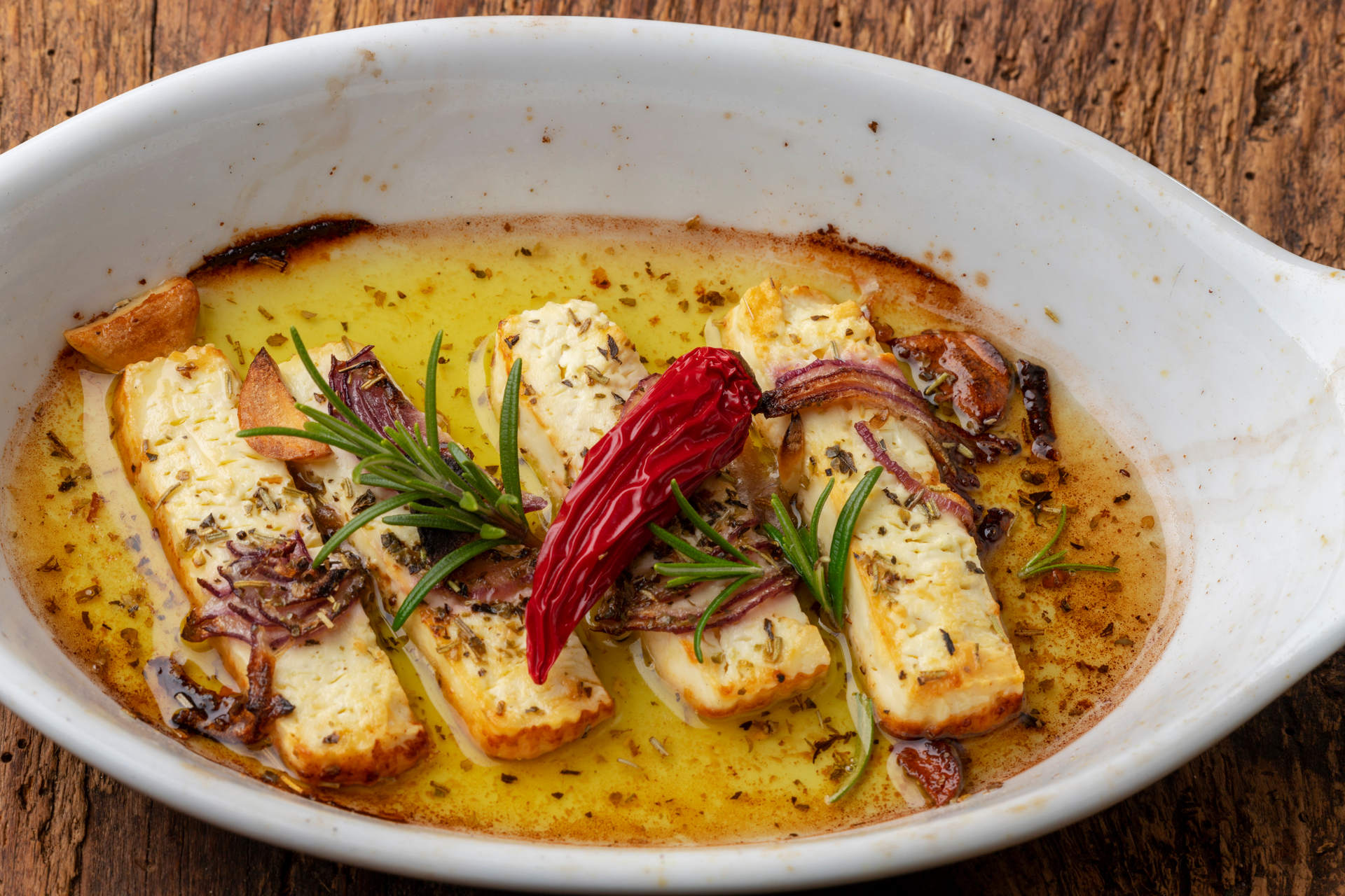 Creamy Brazilian Bacalhau à Gomes de Sá with Potato and Black Olives — Main Course served and photographed from above
