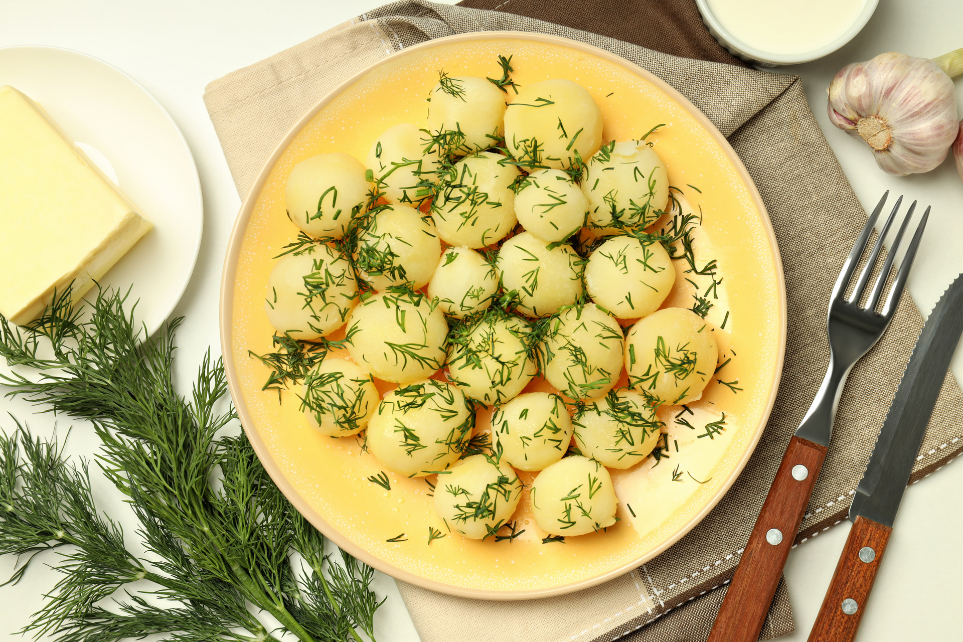 Overhead flat-lay of all ingredients for Creamy Brussels Sprout Gnocchi with Lemon and Parmesan laid out on a kitchen surface.