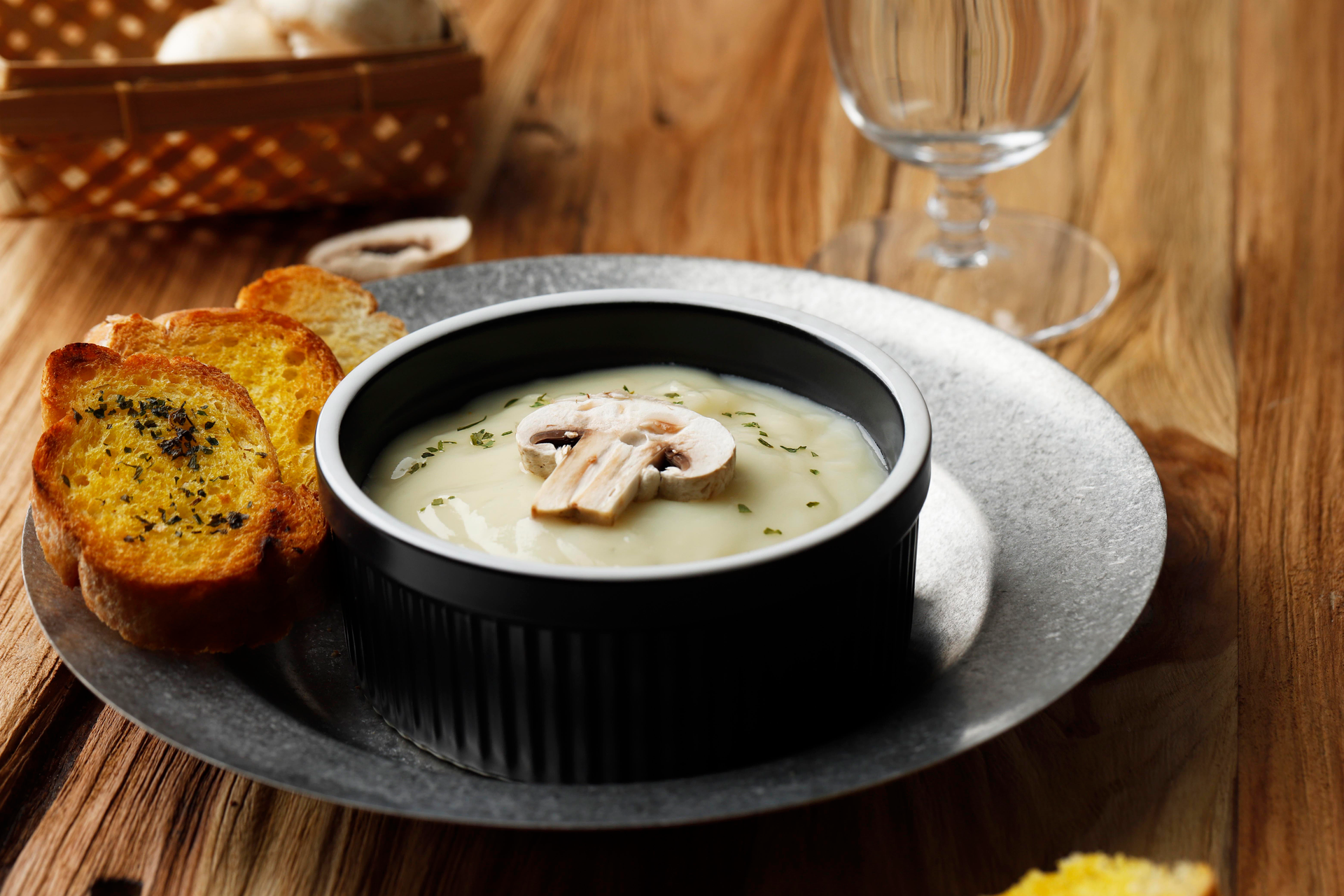 Overhead flat-lay of all ingredients for Creamy Chilean Sopa de Paila with Seafood and White Wine laid out on a kitchen surface.