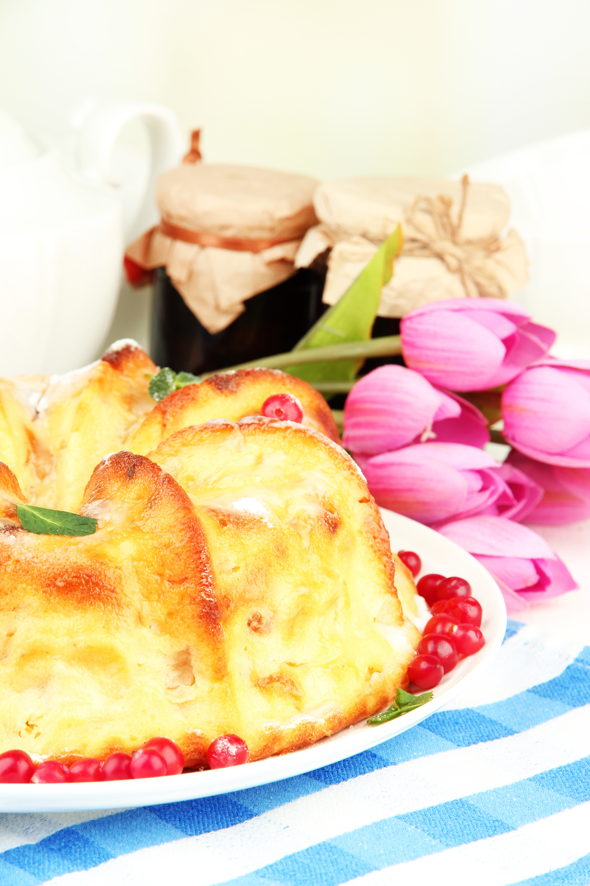 Overhead flat-lay of all ingredients for Creamy Finnish Leipäjuusto with Cloudberry Jam laid out on a kitchen surface.