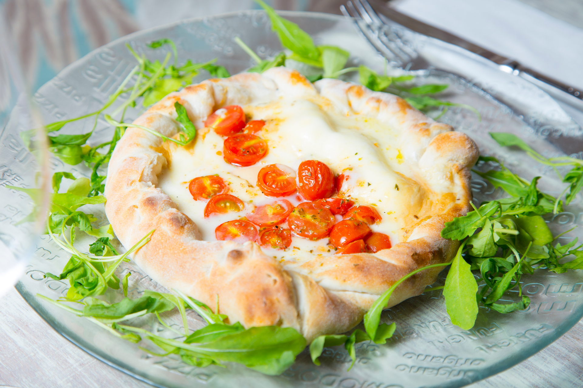 Overhead flat-lay of all ingredients for Creamy Greek Feta Tart with Sun-Dried Tomato Relish laid out on a kitchen surface.