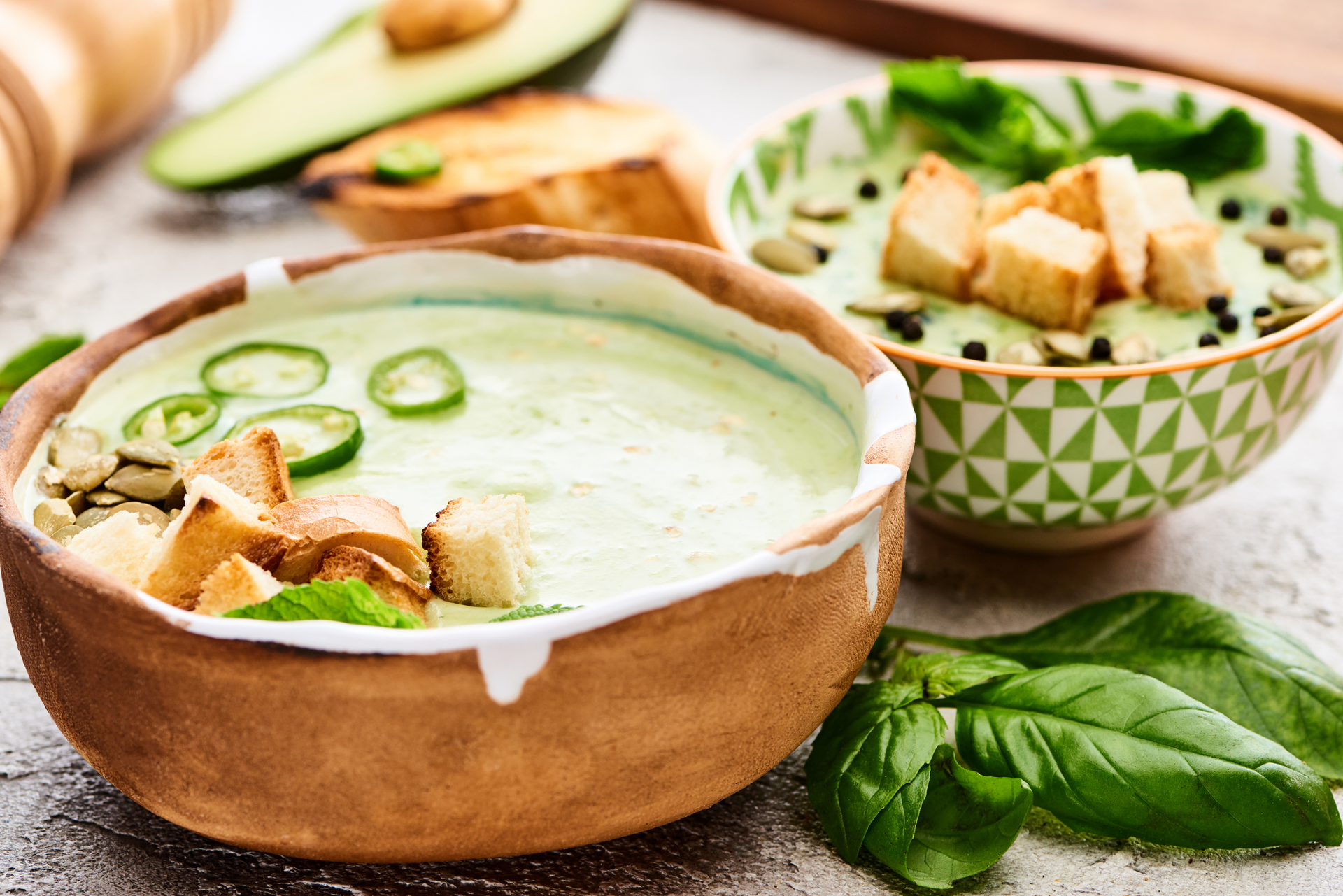 Creamy Guatemalan Avocado Soup with Cilantro Cream — Soup served and photographed from above