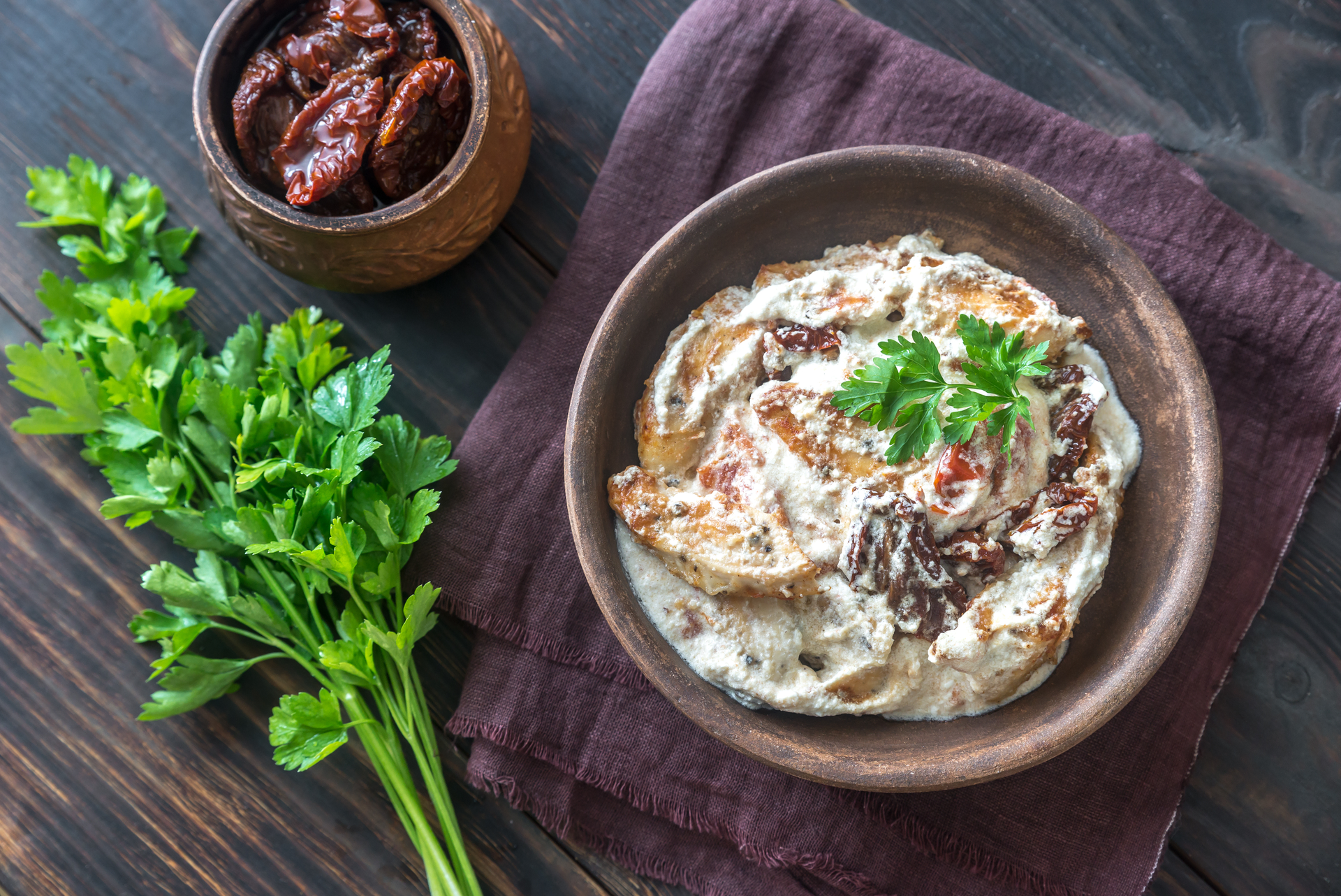 Overhead flat-lay of all ingredients for Creamy Iranian Khoresht Bademjan with Eggplant and Lamb laid out on a kitchen surface.