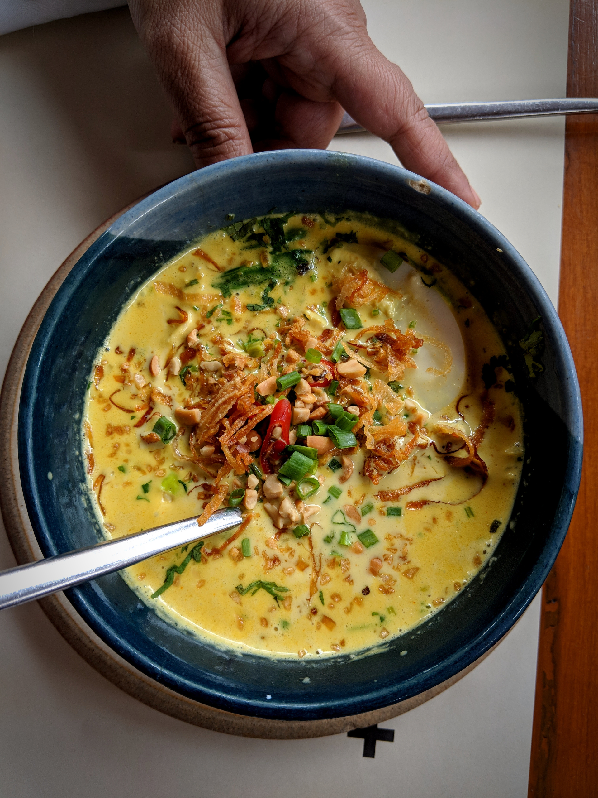 Overhead flat-lay of all ingredients for Creamy Kenyan Githeri Soup with Coconut and Corn laid out on a kitchen surface.