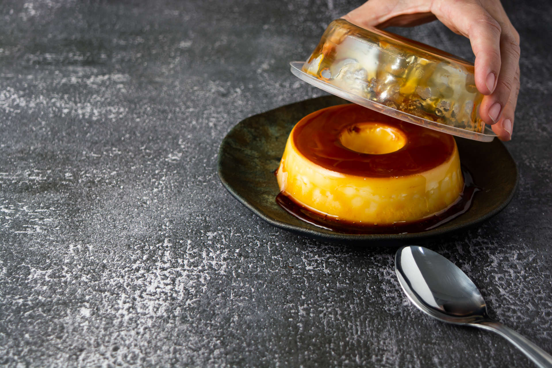 Overhead flat-lay of all ingredients for Creamy Madagascan Vanilla Rum Flan with Caramel Crust laid out on a kitchen surface.