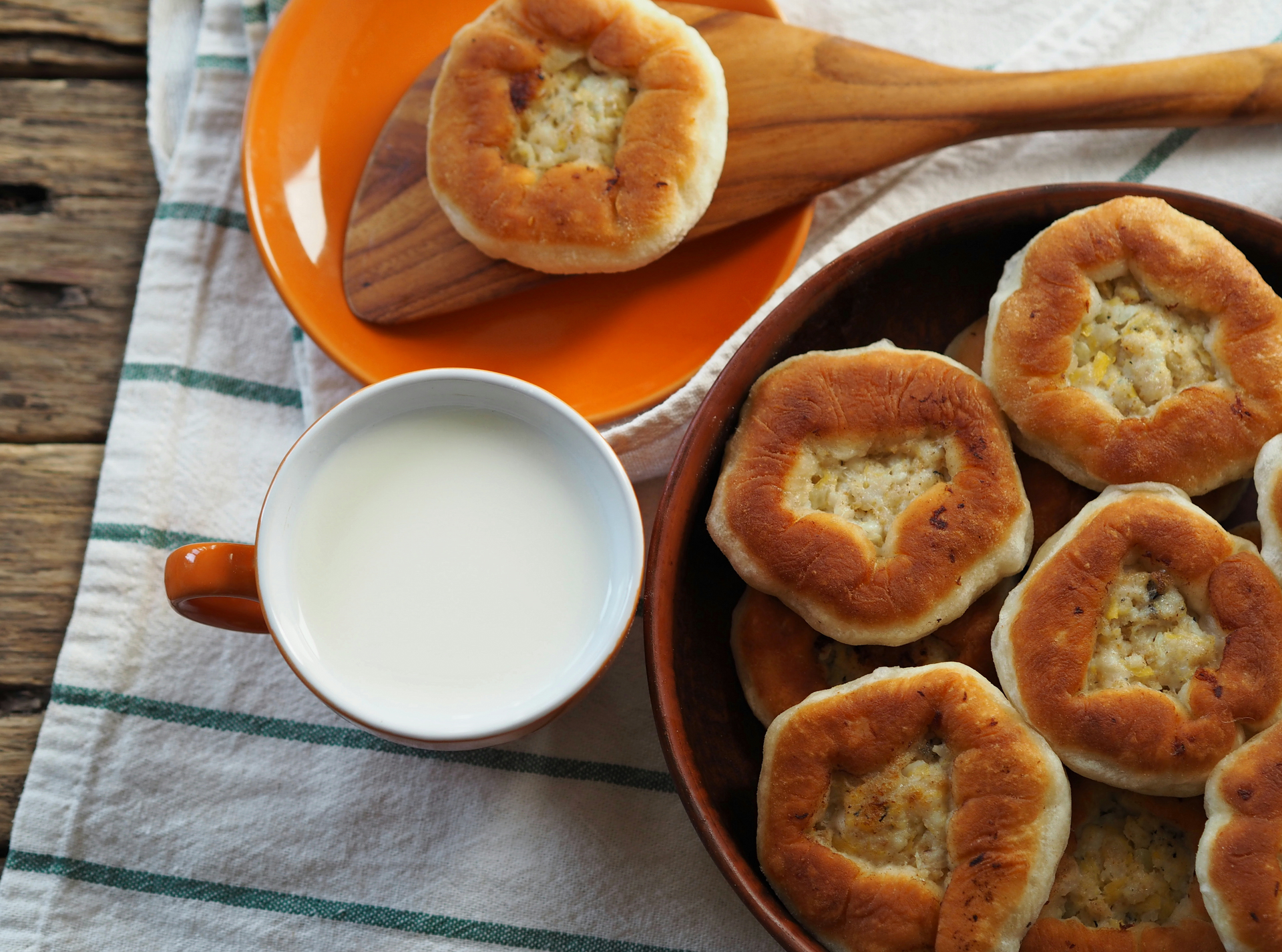 Overhead flat-lay of all ingredients for Creamy Russian Sirniki with Sweetened Condensed Milk laid out on a kitchen surface.
