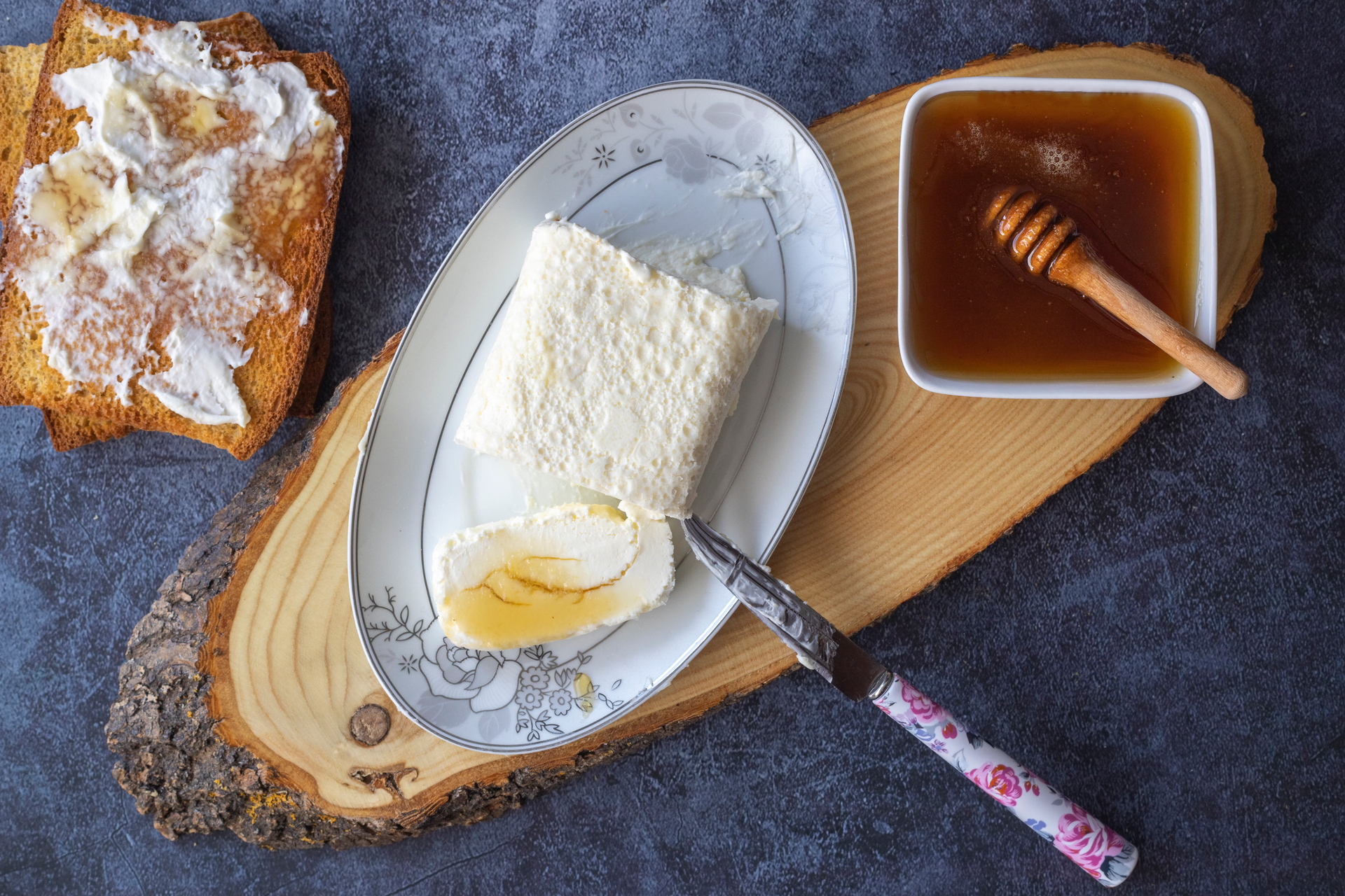 Overhead flat-lay of all ingredients for Creamy Turkish Kaymak with Acacia Honey laid out on a kitchen surface.