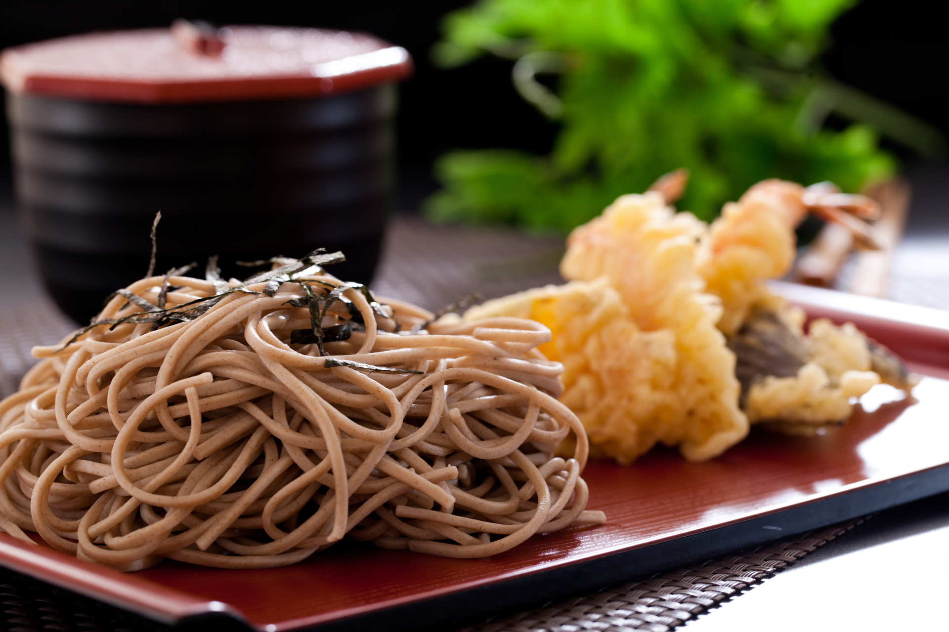Overhead flat-lay of all ingredients for Crisp Japanese Tempura Udon with Shiitake Mushrooms laid out on a kitchen surface.
