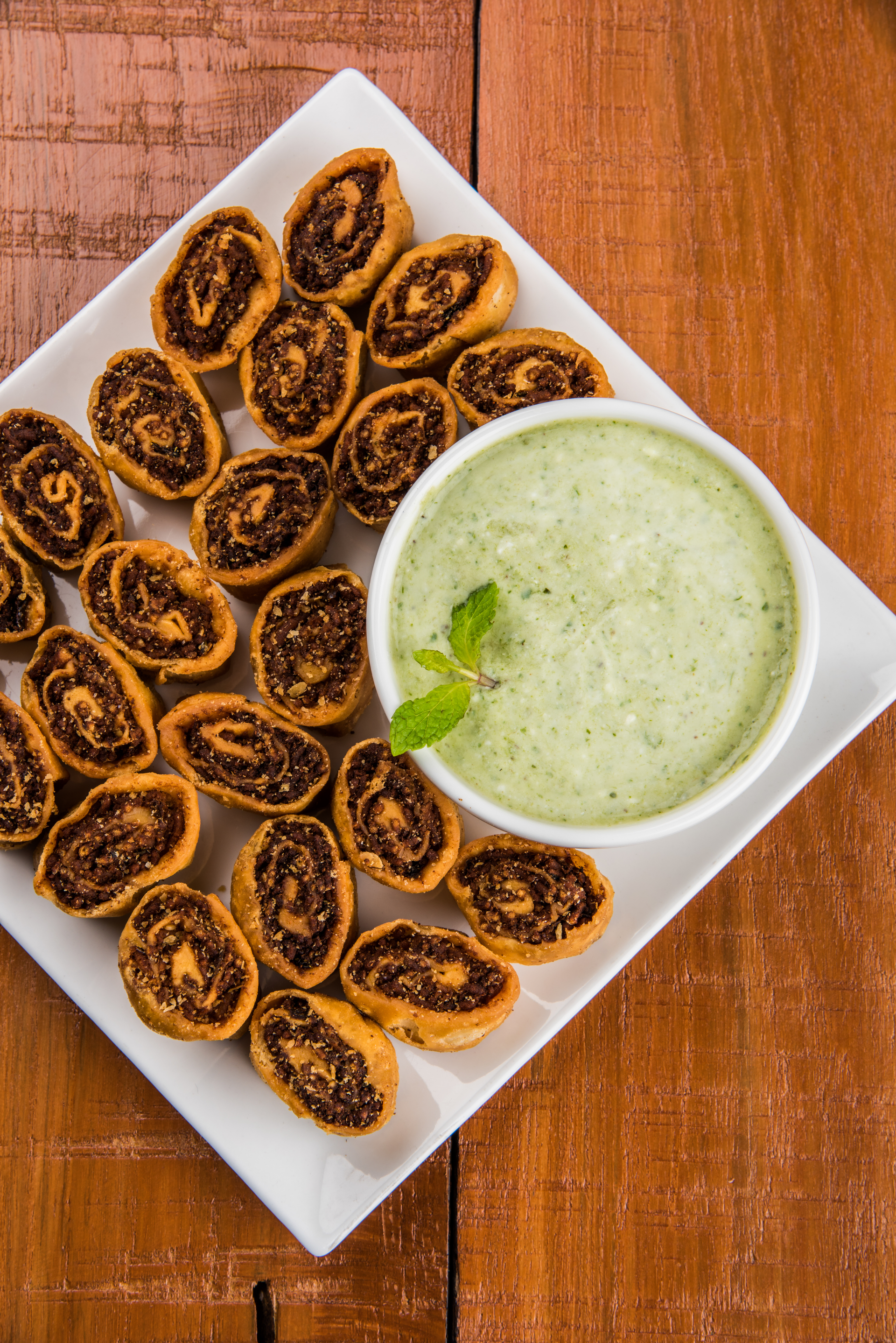 Overhead flat-lay of all ingredients for Crisp Mauritian Gateau Piments with Coriander Chutney laid out on a kitchen surface.