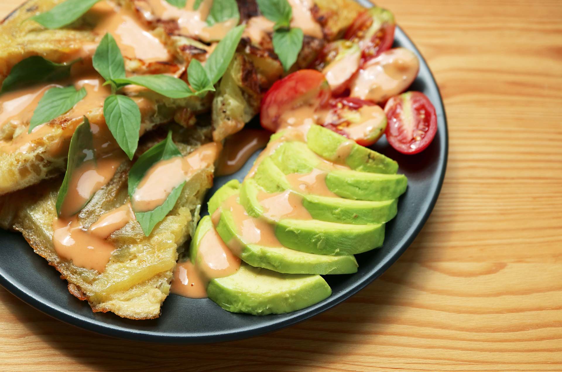 Overhead flat-lay of all ingredients for Crispy Costa Rican Patacones with Avocado Salsa laid out on a kitchen surface.