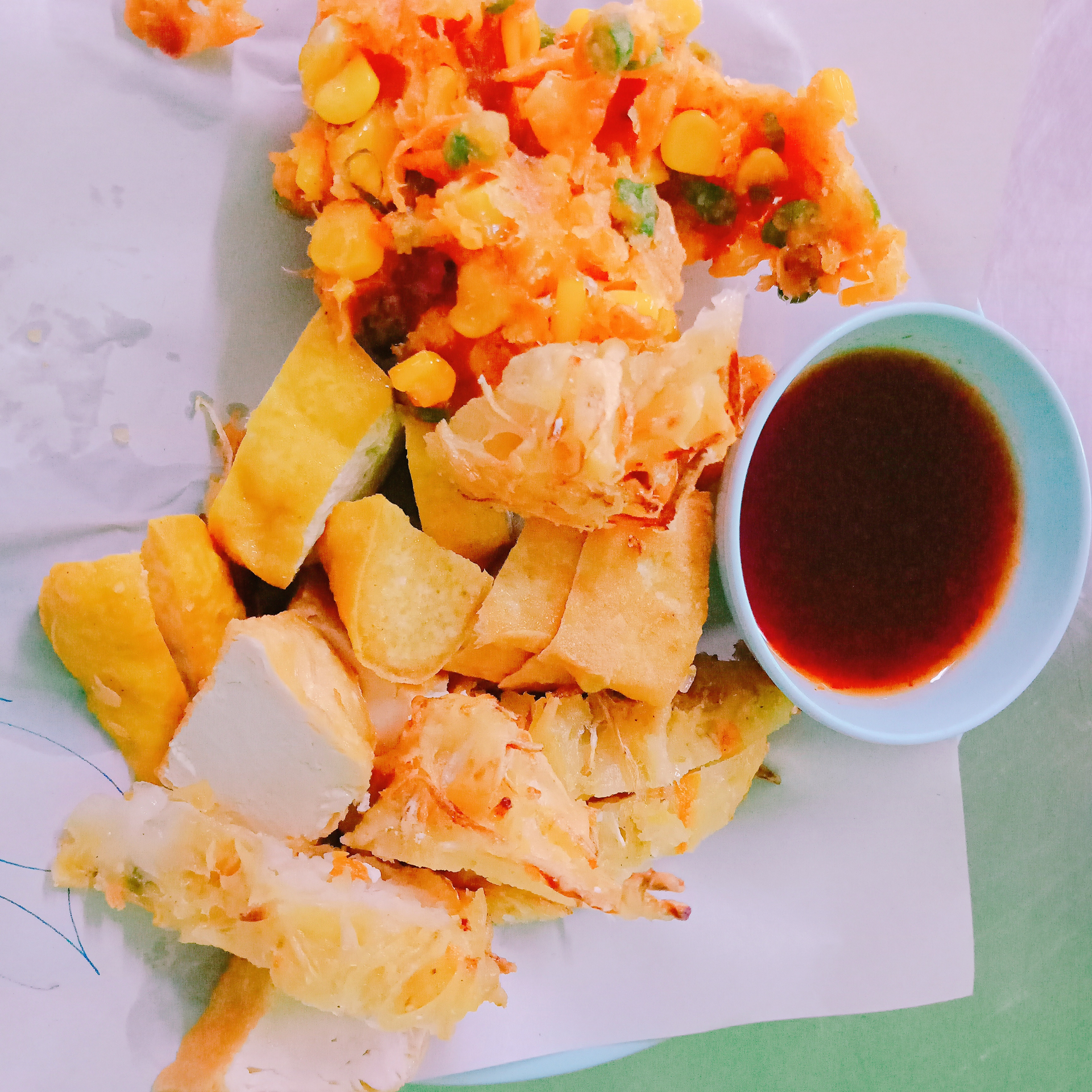 Overhead flat-lay of all ingredients for Crispy Filipino Lumpiang Shanghai with Sweet and Sour Dip laid out on a kitchen surface.