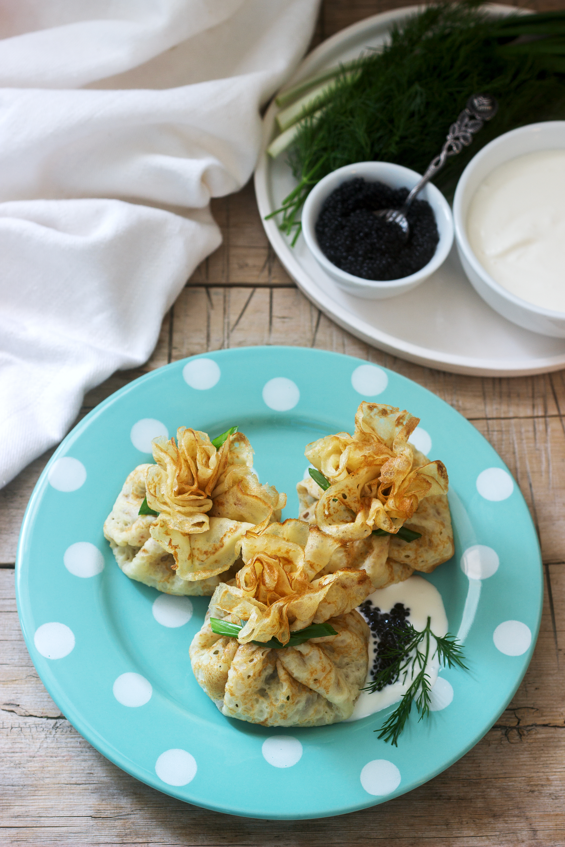 Overhead flat-lay of all ingredients for Crispy Himalayan Buckwheat Momos with Yak Cheese Filling laid out on a kitchen surface.