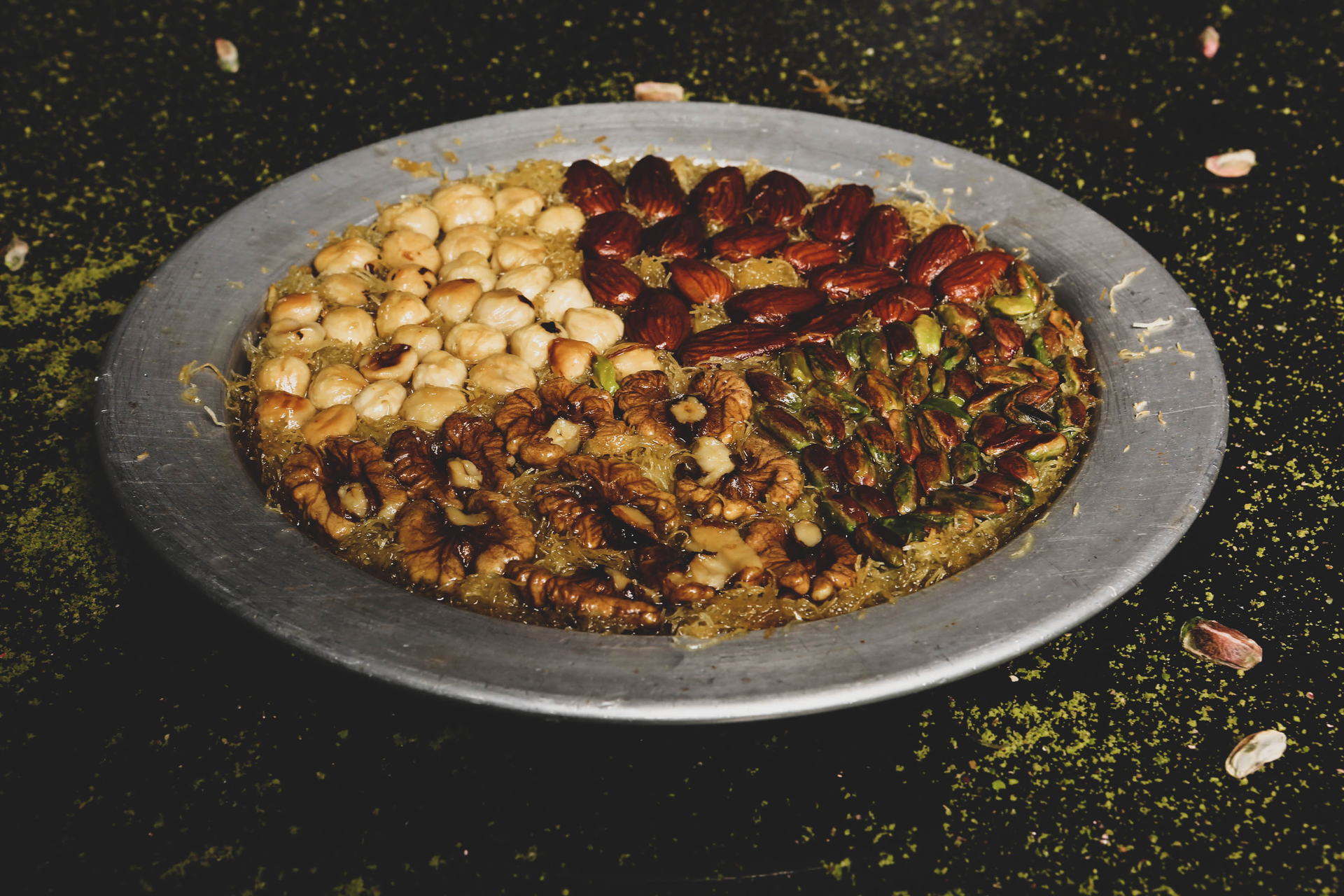 Overhead flat-lay of all ingredients for Crispy Palestinian Maqluba with Spiced Lamb and Pine Nut Garnish laid out on a kitchen surface.