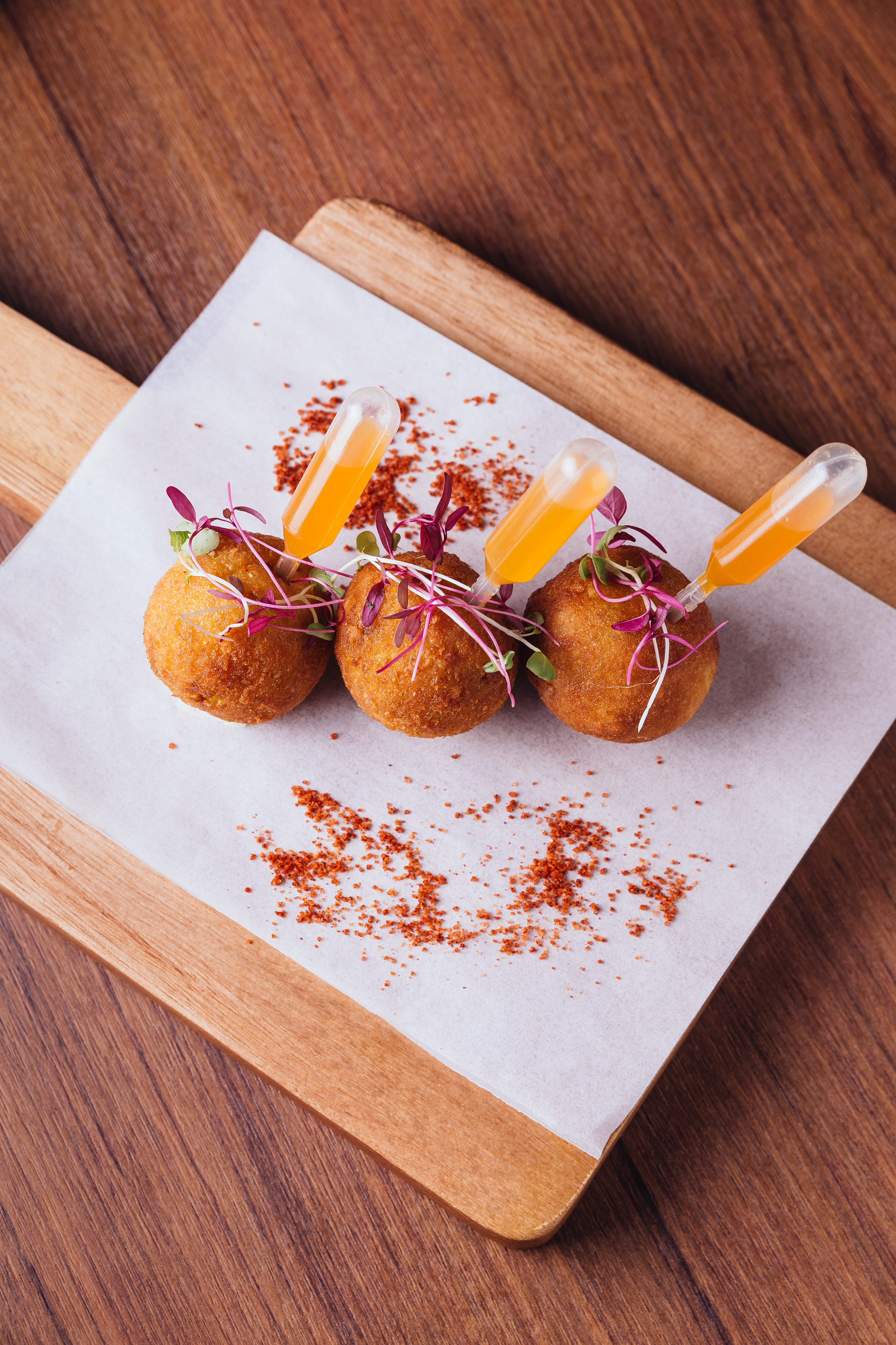Overhead flat-lay of all ingredients for Crispy Spanish Croquetas de Jamón with Saffron Aioli laid out on a kitchen surface.