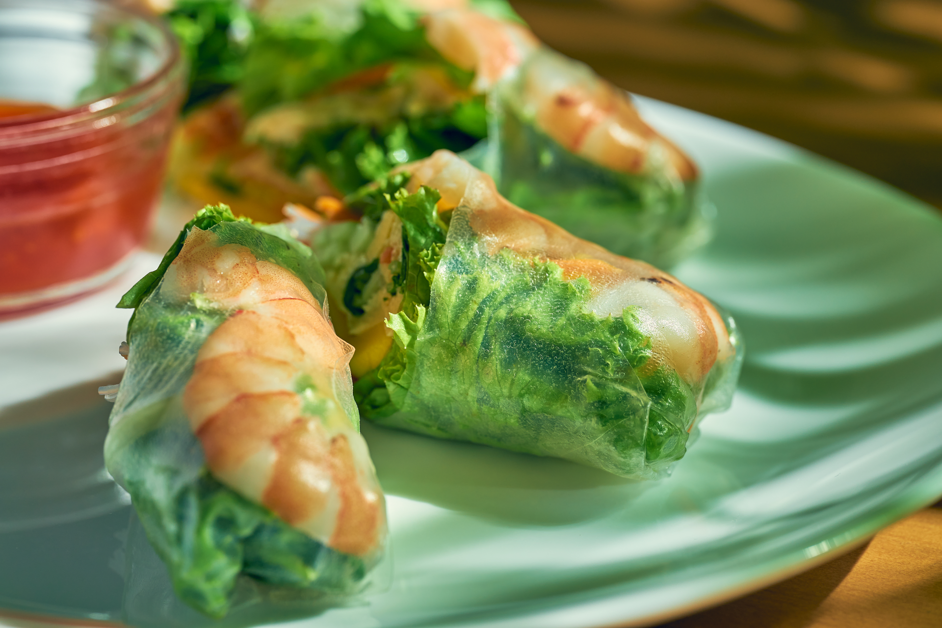 Overhead flat-lay of all ingredients for Crispy Vietnamese Saigon Shrimp Rolls with Minty Veggie Medley laid out on a kitchen surface.