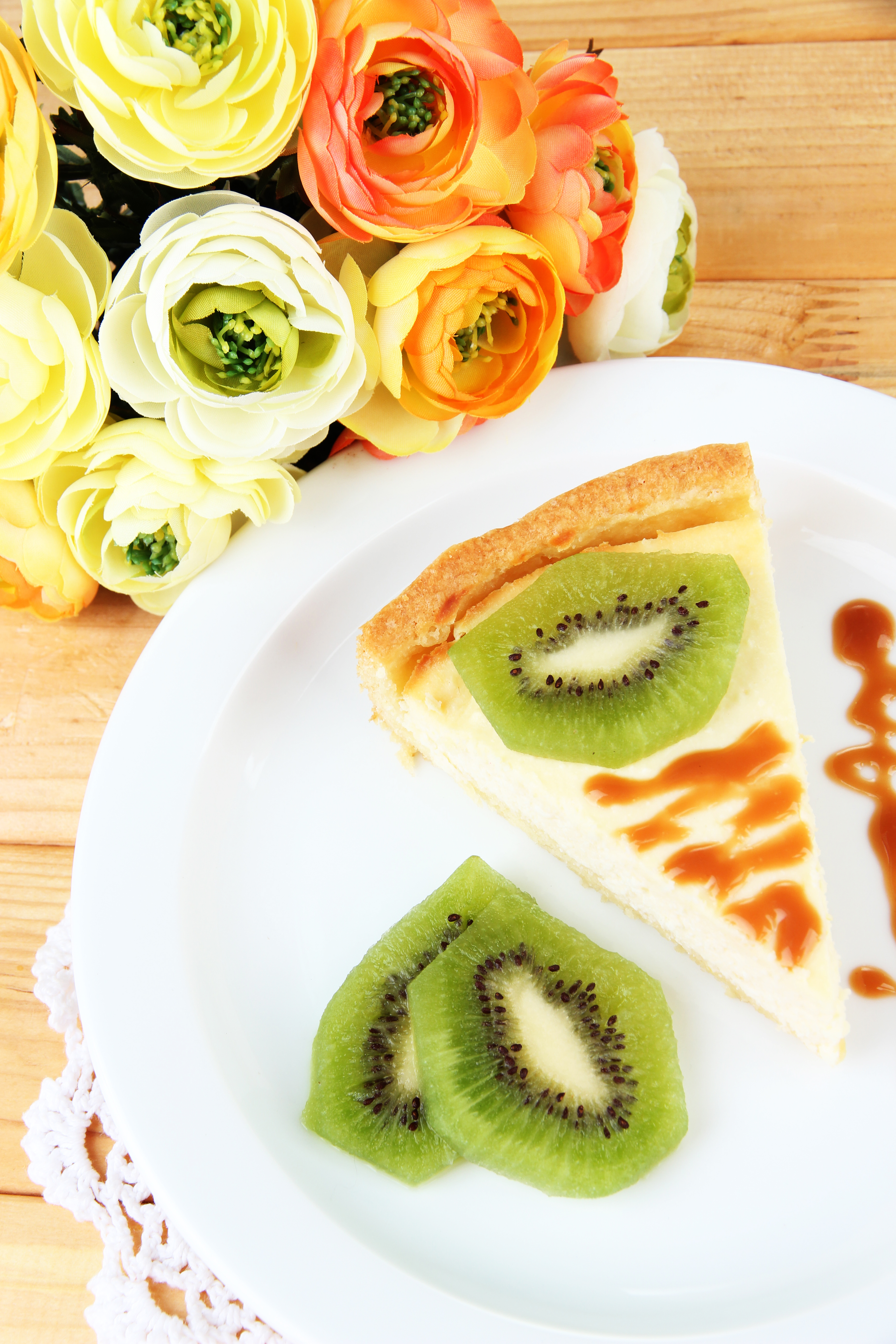 Overhead flat-lay of all ingredients for Crunchy New Zealand Pavlova with Kiwi Fruit laid out on a kitchen surface.