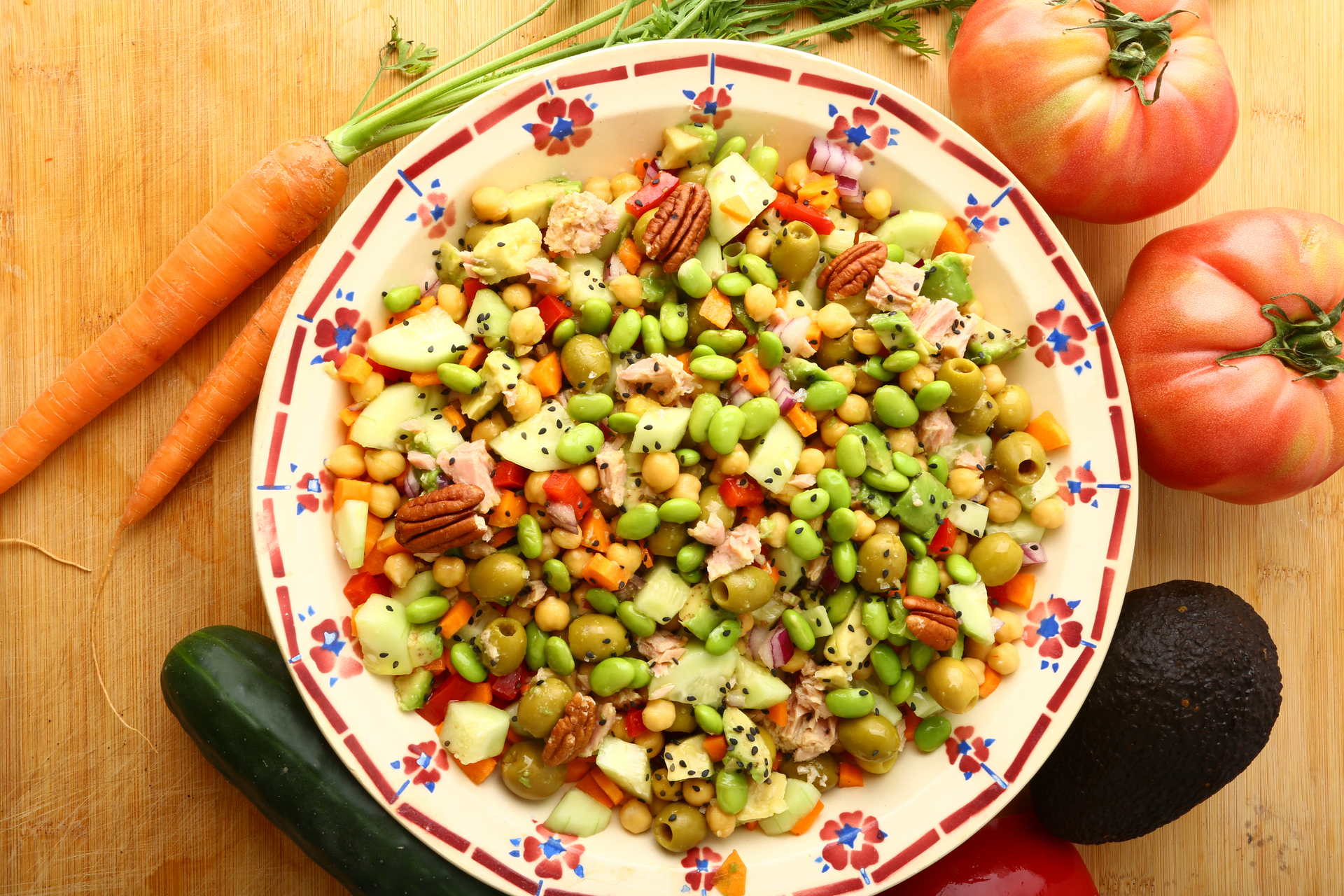 Overhead flat-lay of all ingredients for Crunchy Russian Olivye Salad with Peas and Carrot laid out on a kitchen surface.