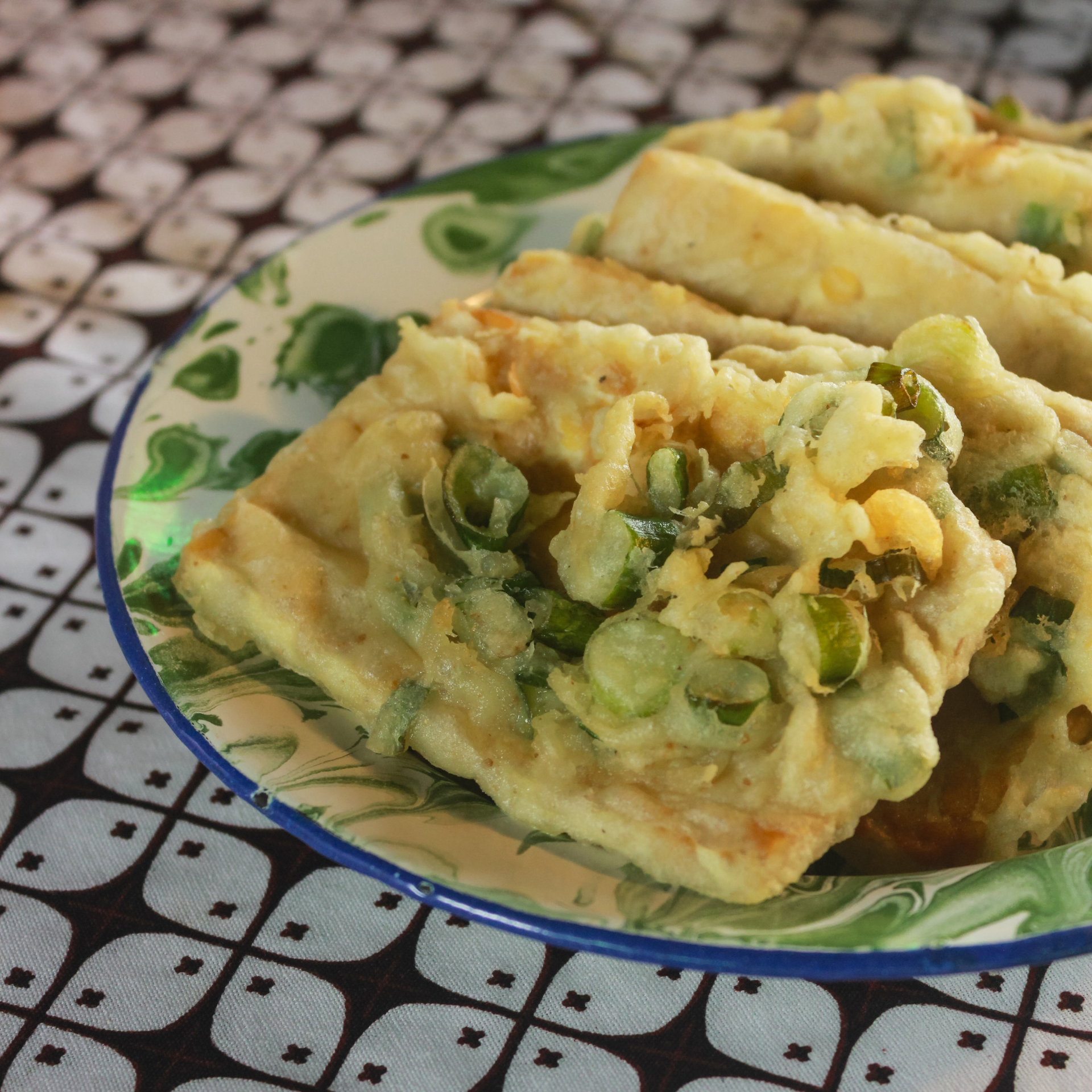 Overhead flat-lay of all ingredients for Crunchy Sri Lankan Coconut Roti with Green Chili Sambol laid out on a kitchen surface.