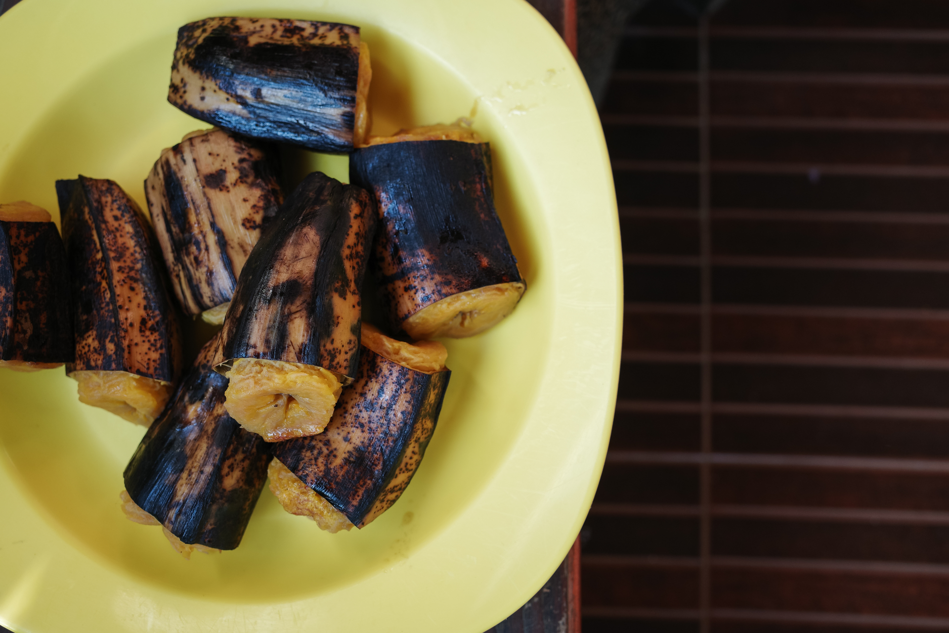 Overhead flat-lay of all ingredients for Cuban Mojo Pork Belly with Caramelized Plantains laid out on a kitchen surface.