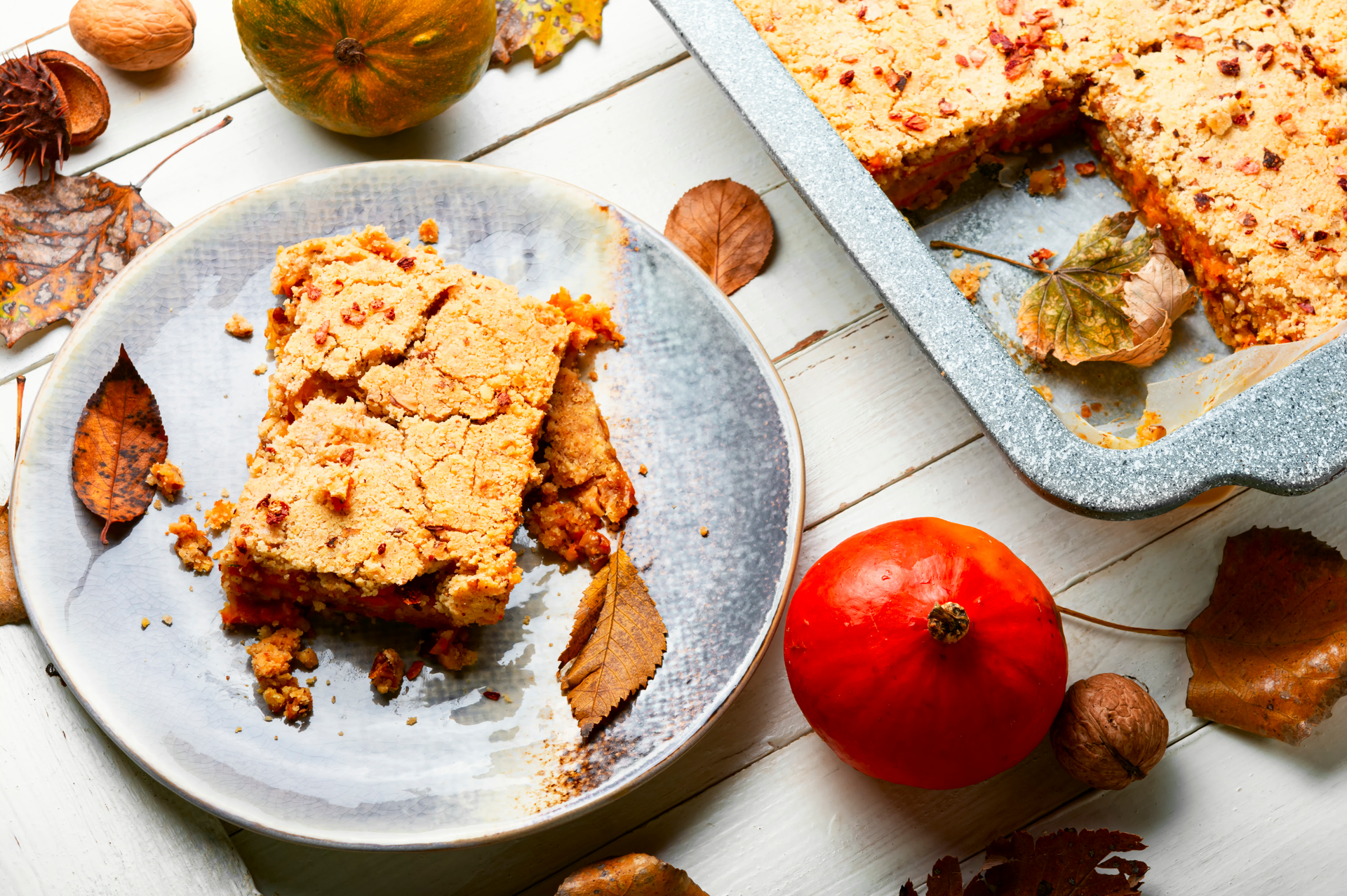 Overhead flat-lay of all ingredients for Danish Æblekage with Rye Bread Crumbs and Apples laid out on a kitchen surface.