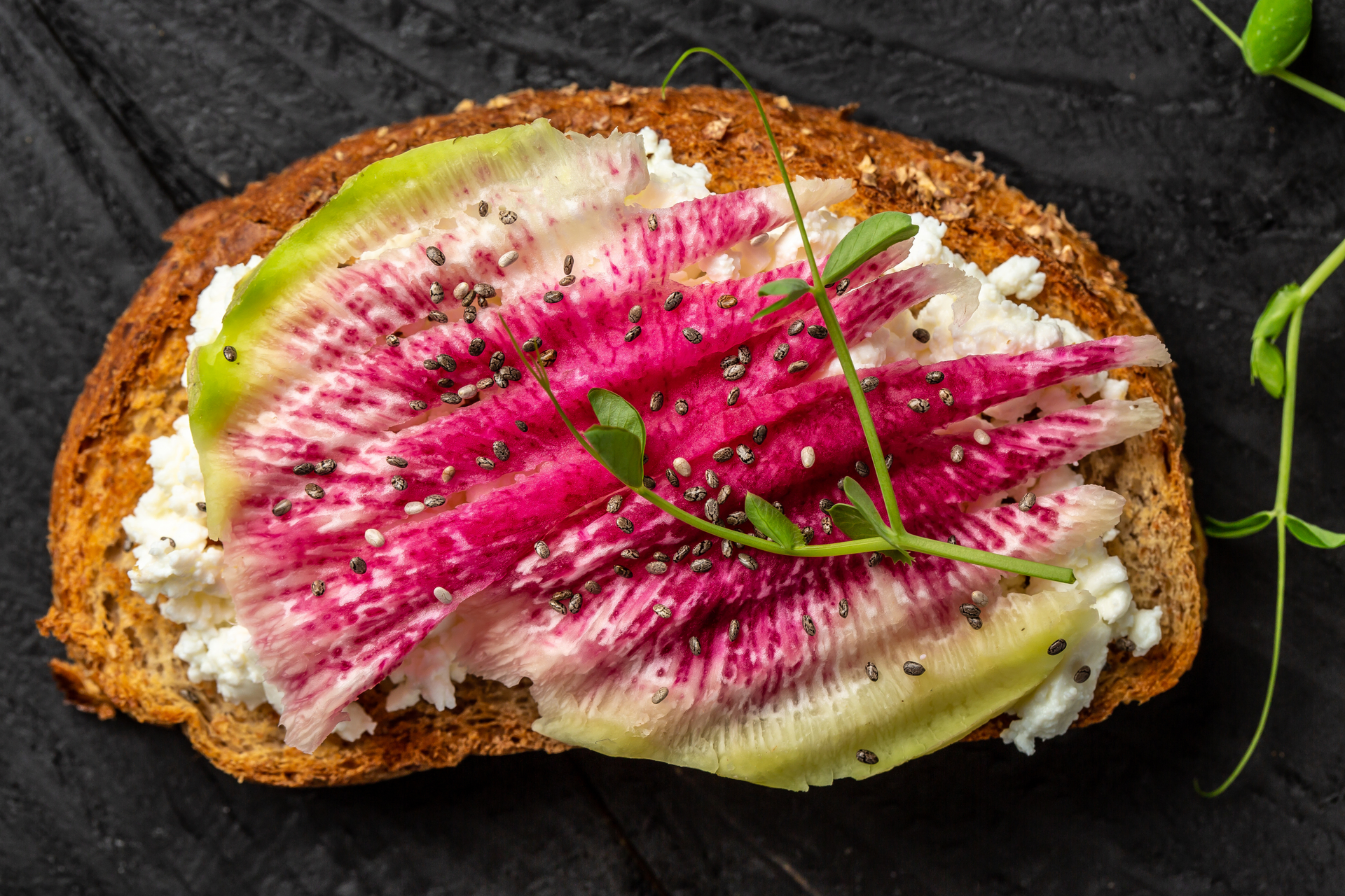 Overhead flat-lay of all ingredients for Danish Rye Bread Open-Sandwich with Horseradish Cream and Pickled Beets laid out on a kitchen surface.