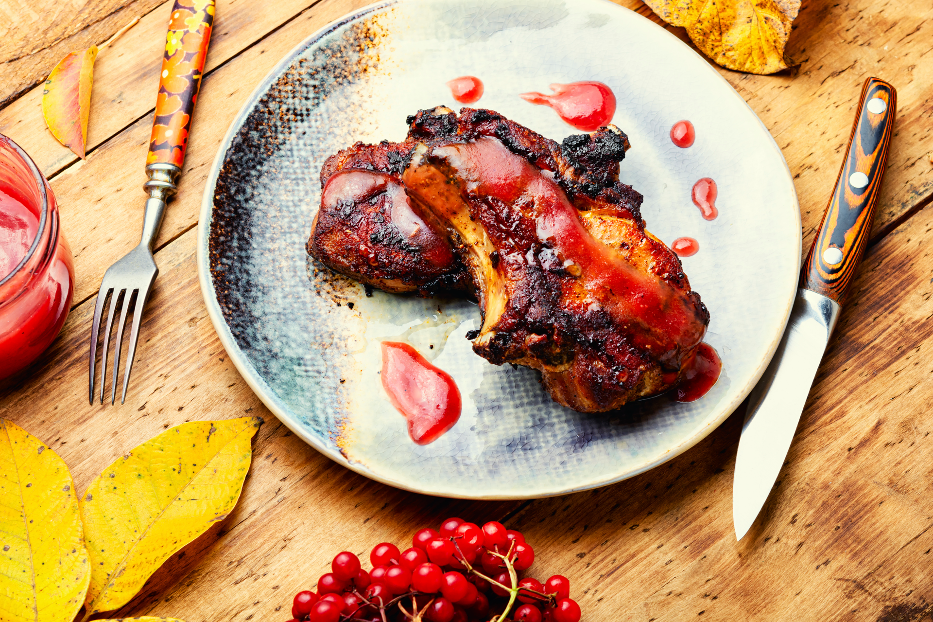 Overhead flat-lay of all ingredients for Decadent Belgian Cherry Beer Glazed Duck with Juniper Berries laid out on a kitchen surface.