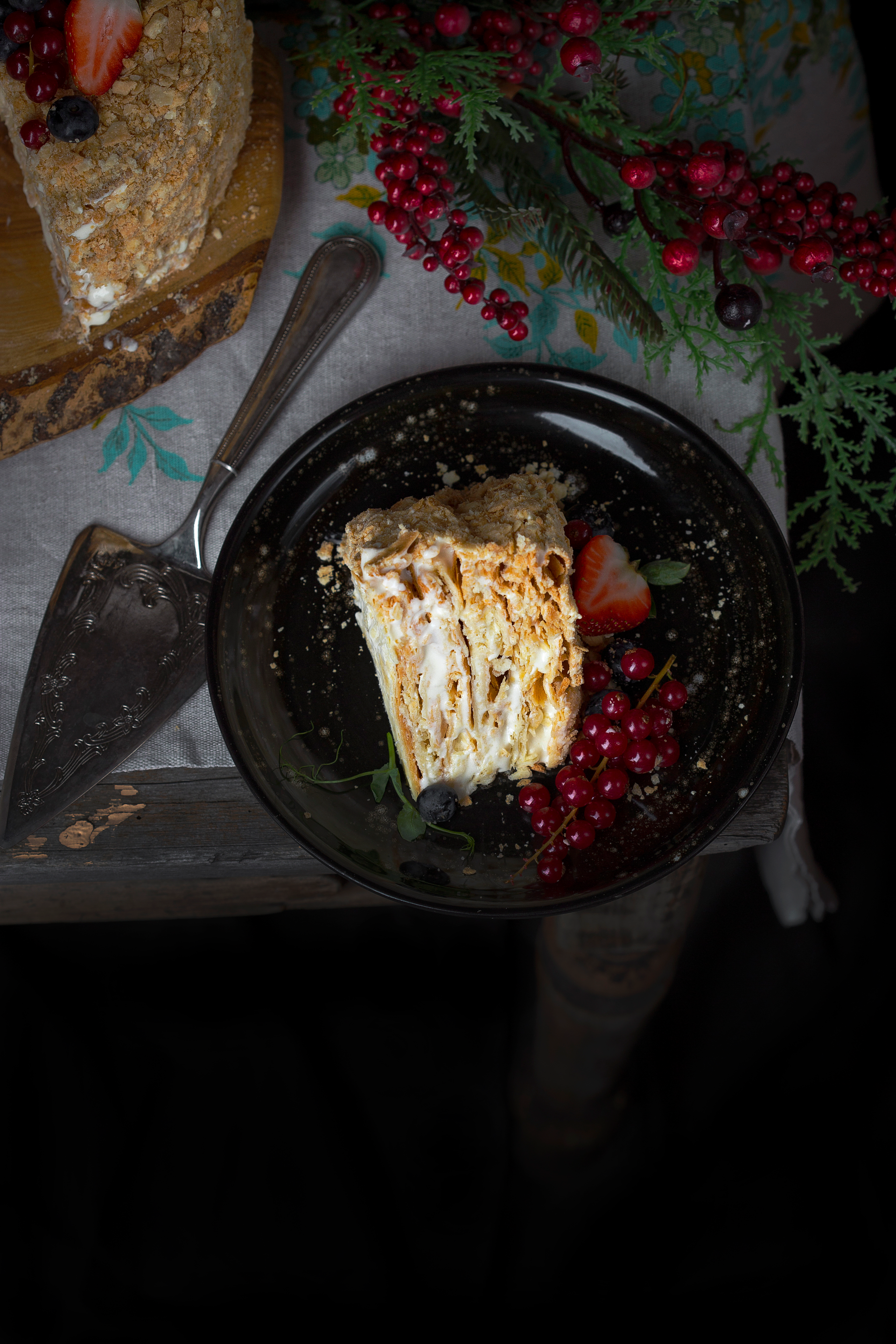 Overhead flat-lay of all ingredients for Decadent Belgian Speculoos Tiramisu with Mascarpone Cream laid out on a kitchen surface.