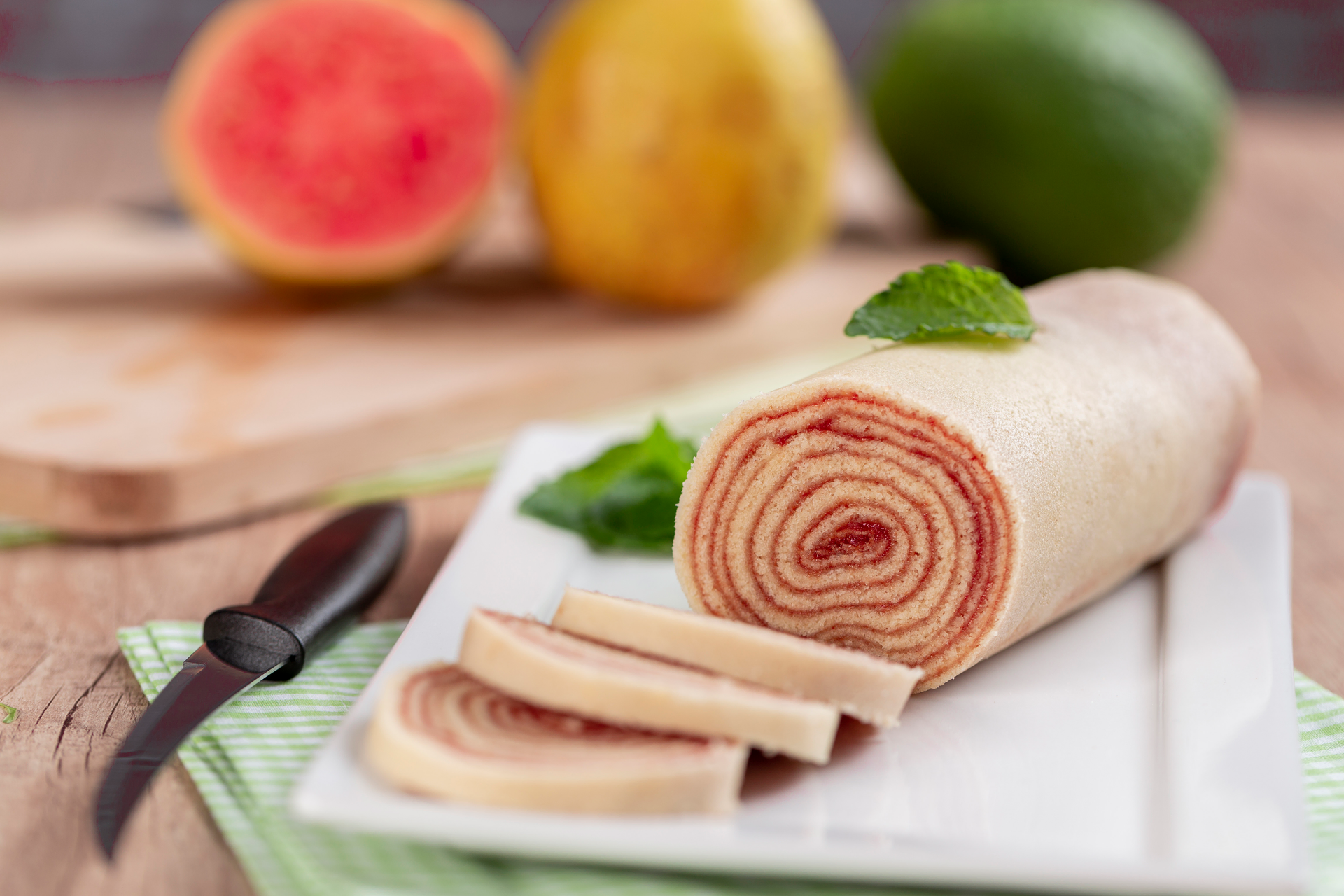 Overhead flat-lay of all ingredients for Decadent Brazilian Bolo de Rolo with Guava Paste laid out on a kitchen surface.