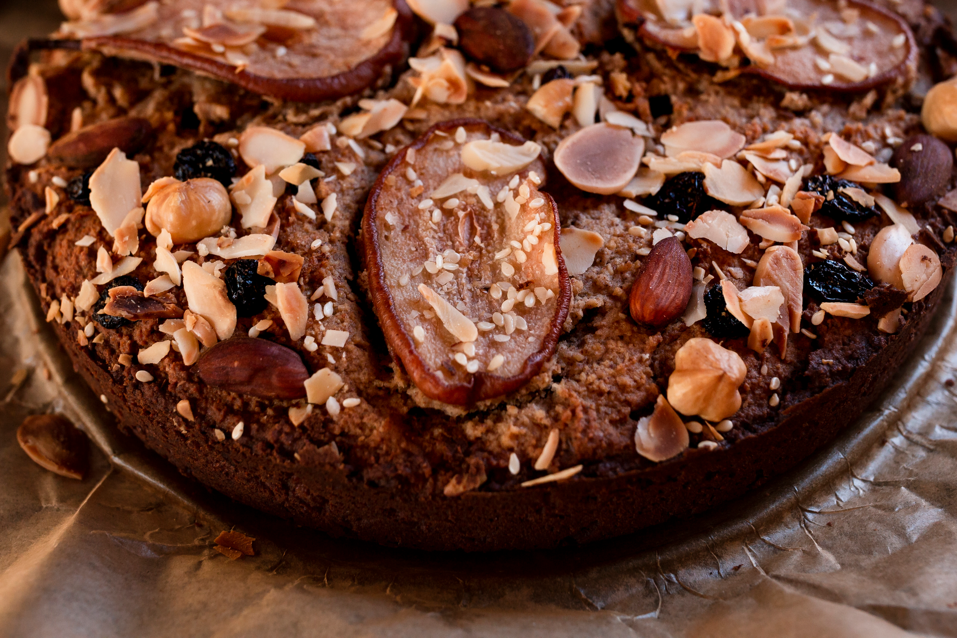 Overhead flat-lay of all ingredients for Decadent Jamaican Rum Cake with Dried Fruits laid out on a kitchen surface.