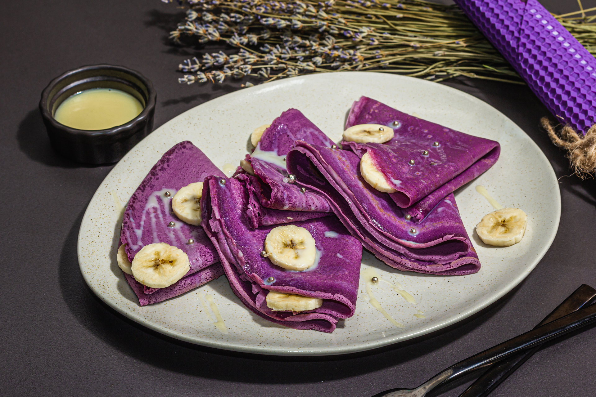 Delicate Filipino Ube Pancakes with Coconut Syrup — Breakfast served and photographed from above