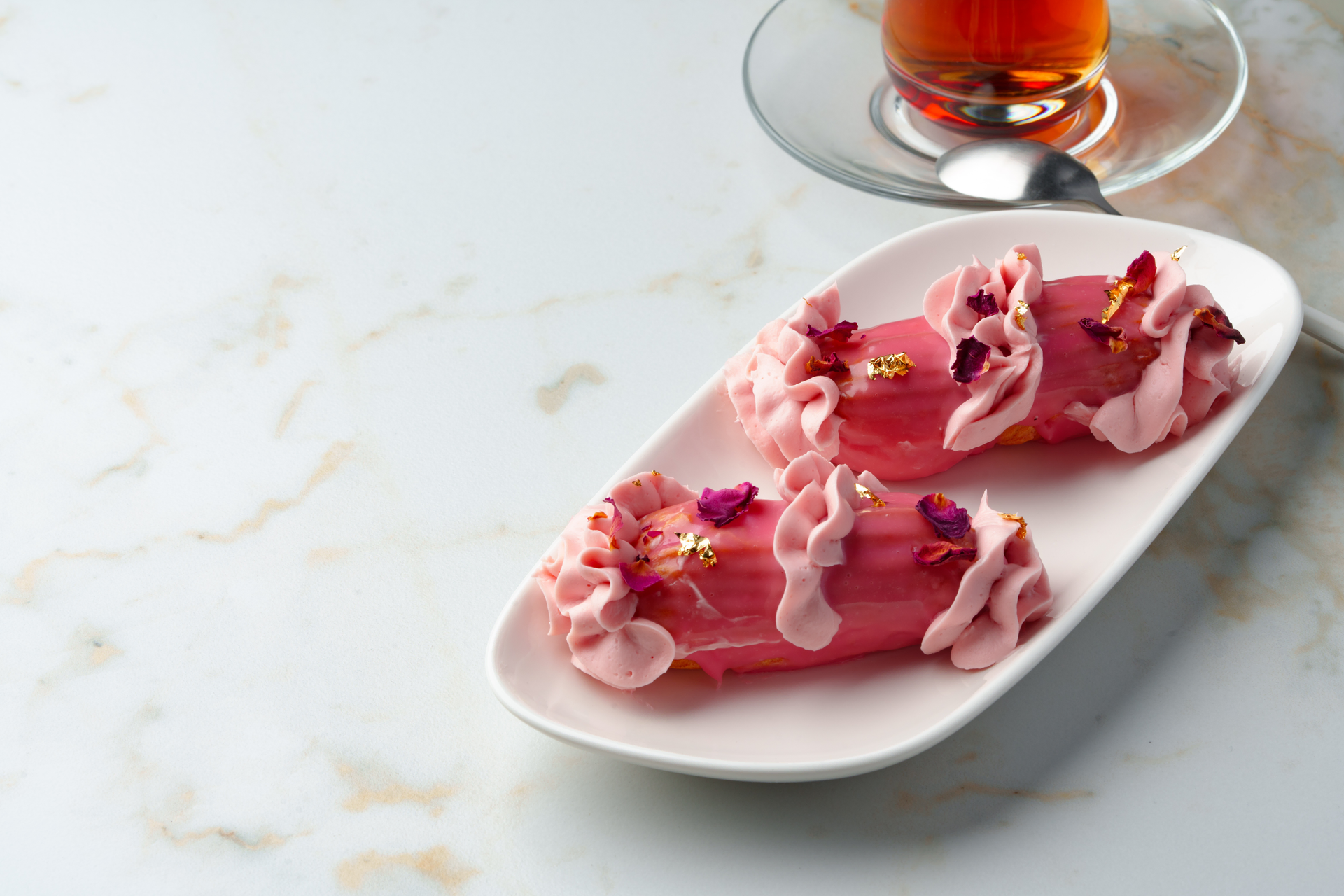 Overhead flat-lay of all ingredients for Delicate Moroccan Rose Water Infused Briouats with Almond Filling laid out on a kitchen surface.