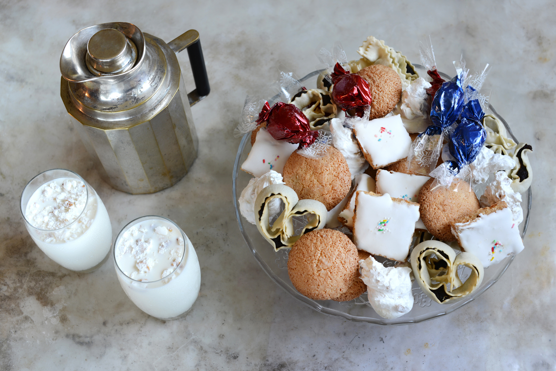Overhead flat-lay of all ingredients for Delicate Moroccan Seffa with Sugar laid out on a kitchen surface.
