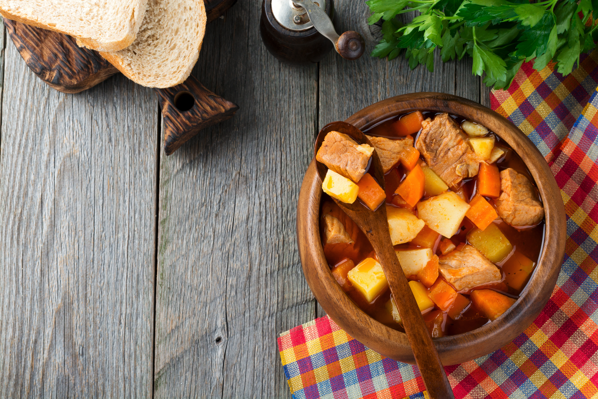 Overhead flat-lay of all ingredients for Delightful Finnish Karelian Stew with Root Vegetables laid out on a kitchen surface.
