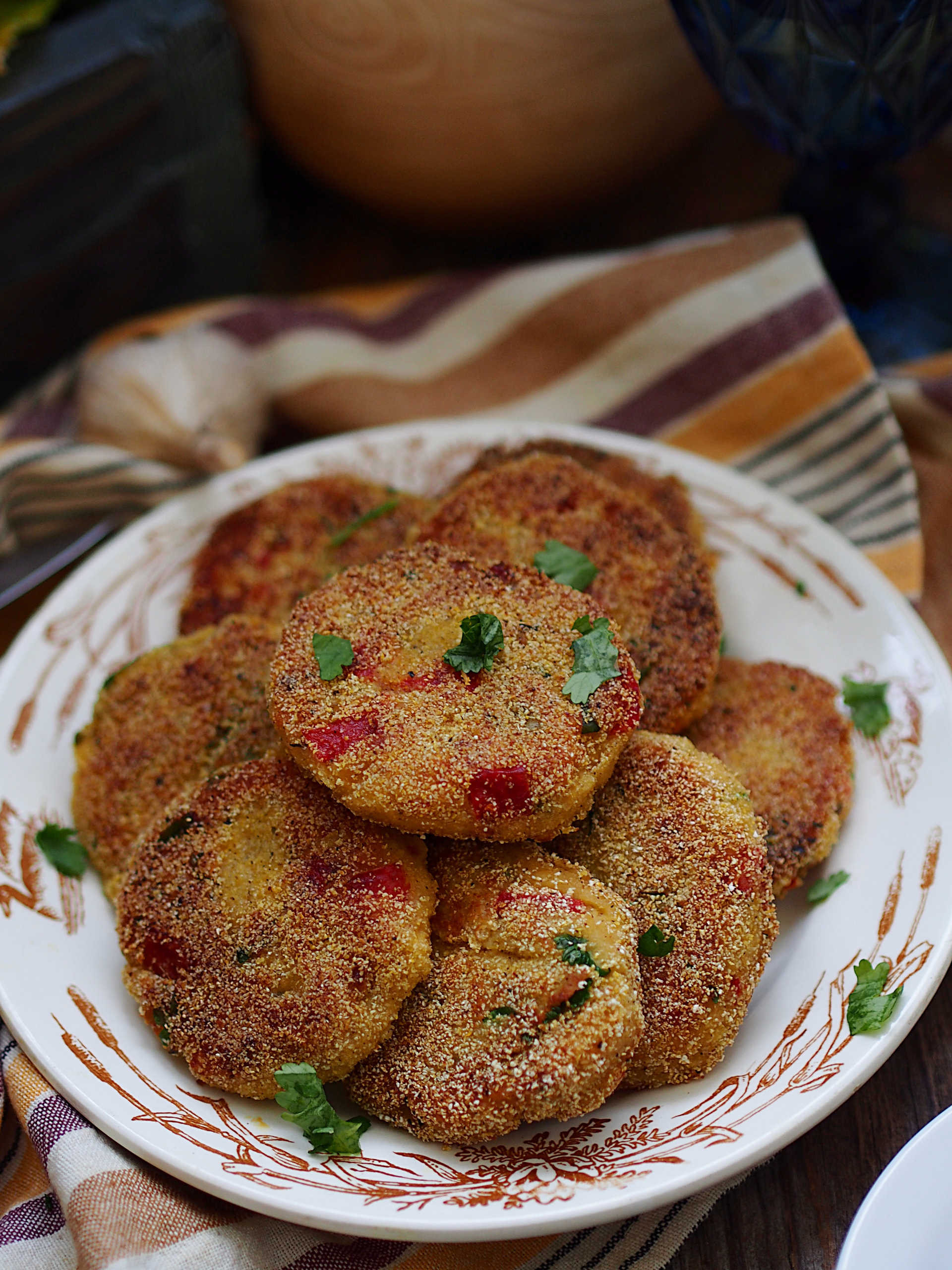 Overhead flat-lay of all ingredients for Egyptian Cauliflower Fritters with Tunisian Taktouka laid out on a kitchen surface.