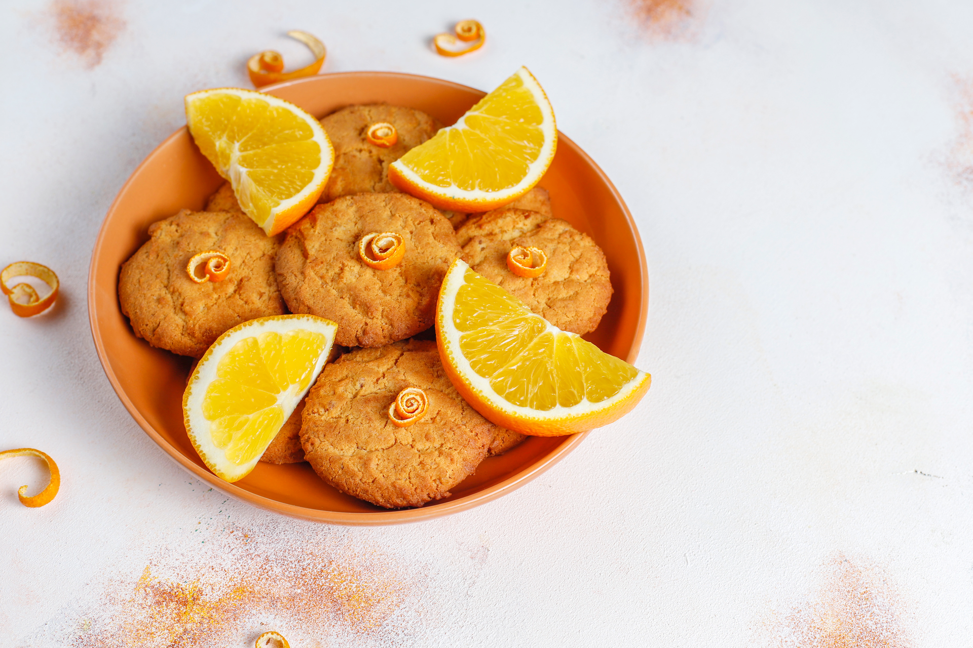 Overhead flat-lay of all ingredients for Egyptian Honey-Sesame Cookies with Orange Zest laid out on a kitchen surface.