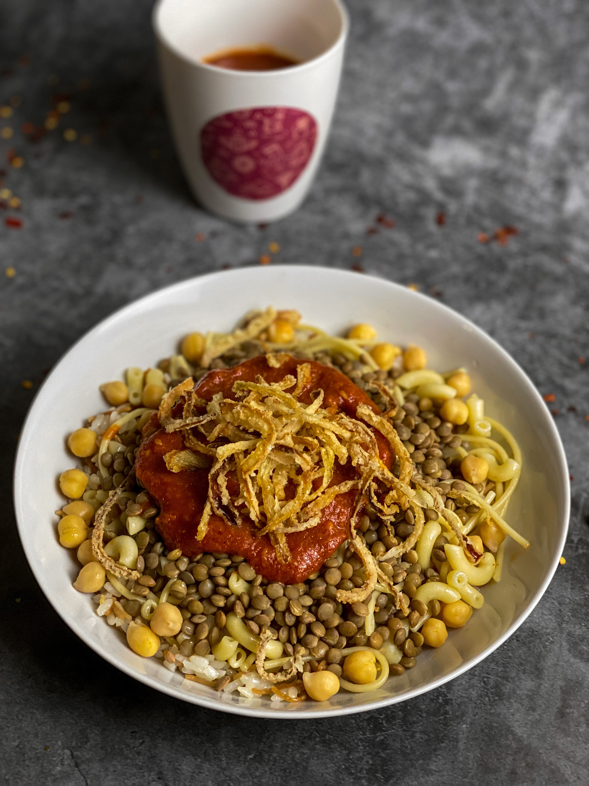 Egyptian Koshari with Lentils and Crispy Onions — Main Course served and photographed from above