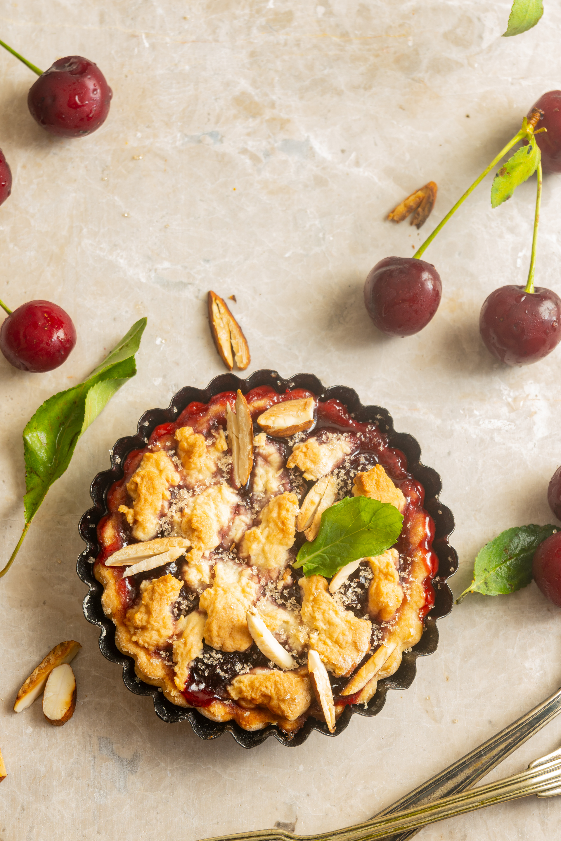 Elegant French Clafoutis with Cherries and Almonds — Dessert served and photographed from above