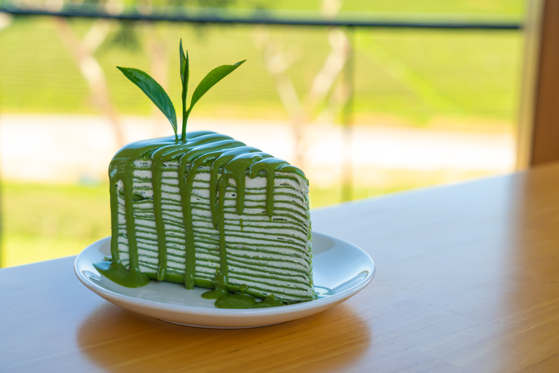 Overhead flat-lay of all ingredients for Emerald Indonesian Pandan Cake with Coconut Milk Drizzle laid out on a kitchen surface.