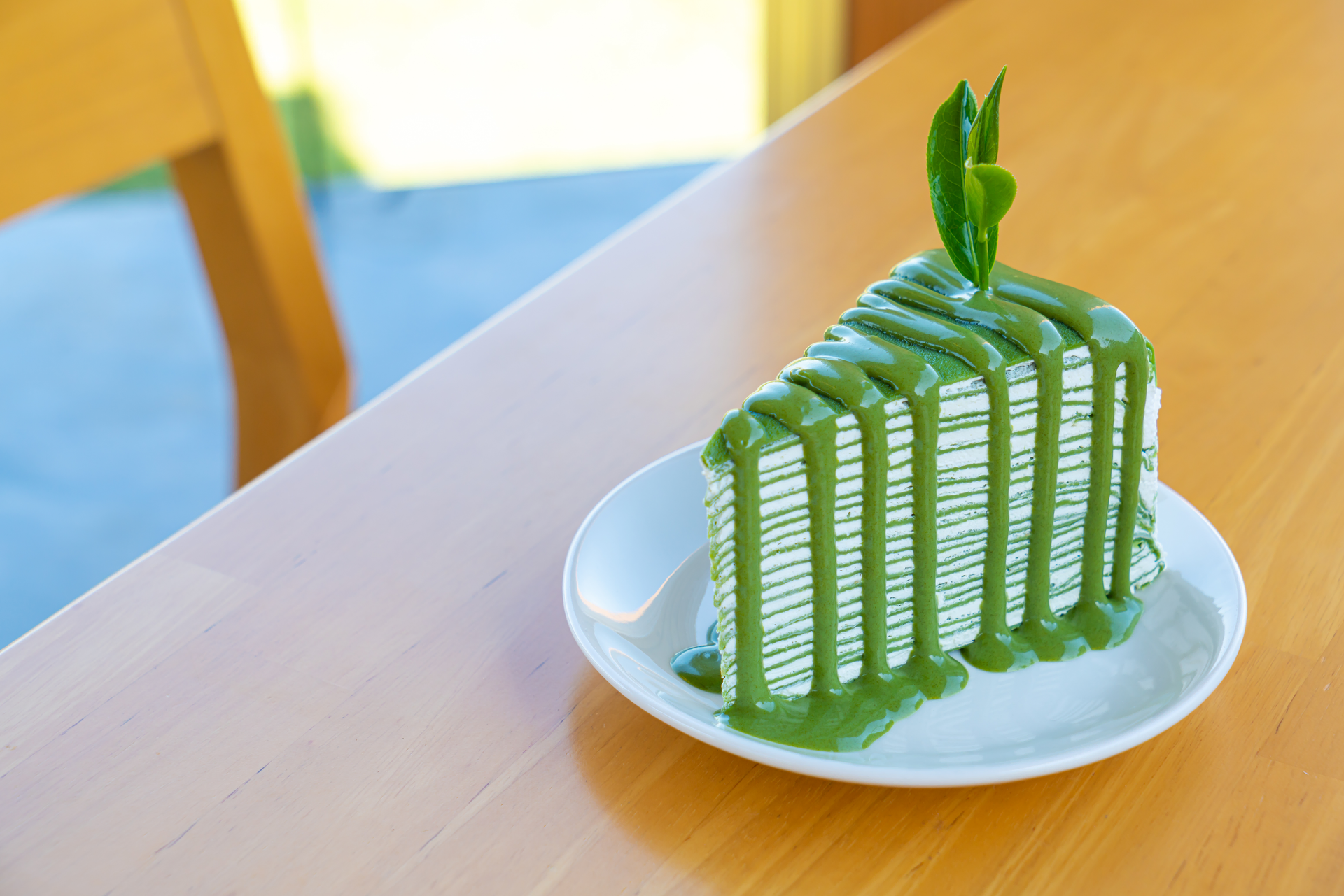 Emerald Indonesian Pandan Cake with Coconut Milk Drizzle — Dessert served and photographed from above