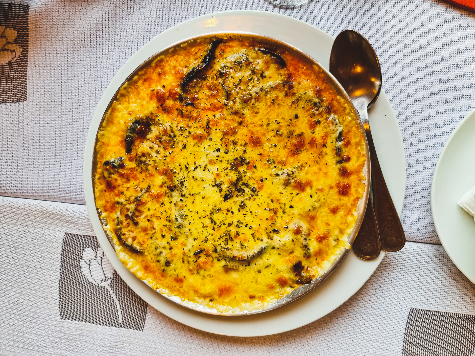Overhead flat-lay of all ingredients for Ethiopian Berbere-Spiced Sweet Potato Gratin with Coconut Cream laid out on a kitchen surface.