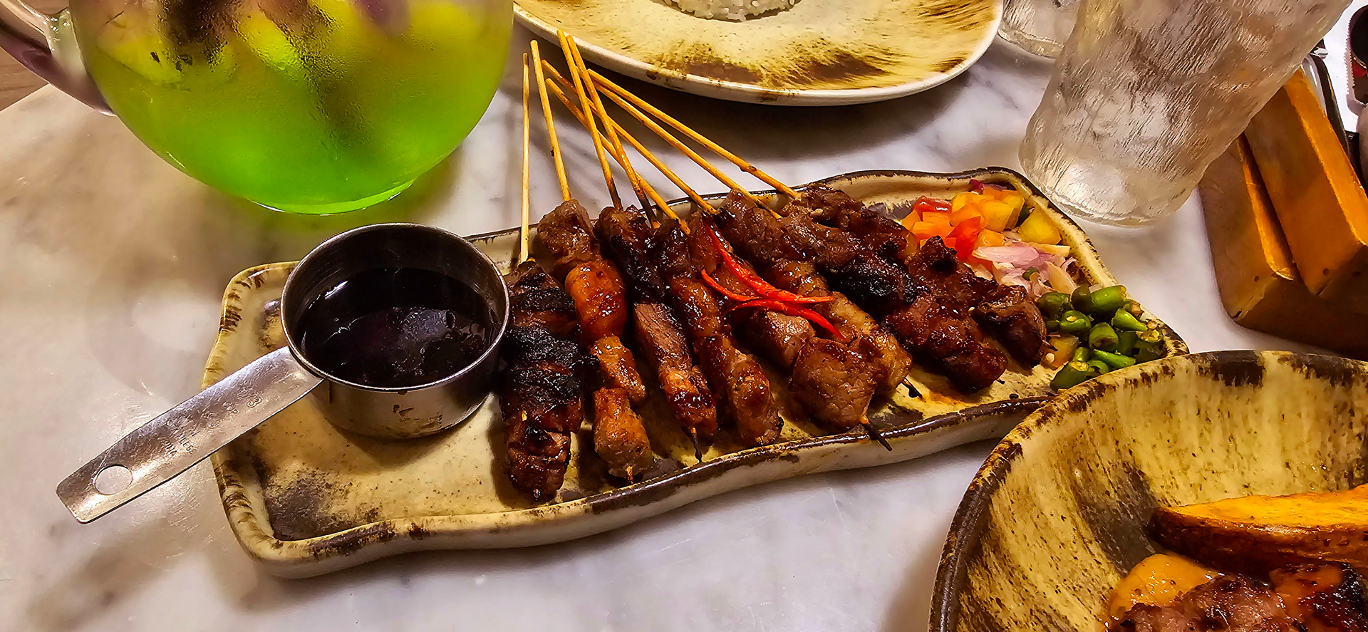Overhead flat-lay of all ingredients for Ethiopian Coffee-Infused Beef Skewers with Berbere laid out on a kitchen surface.