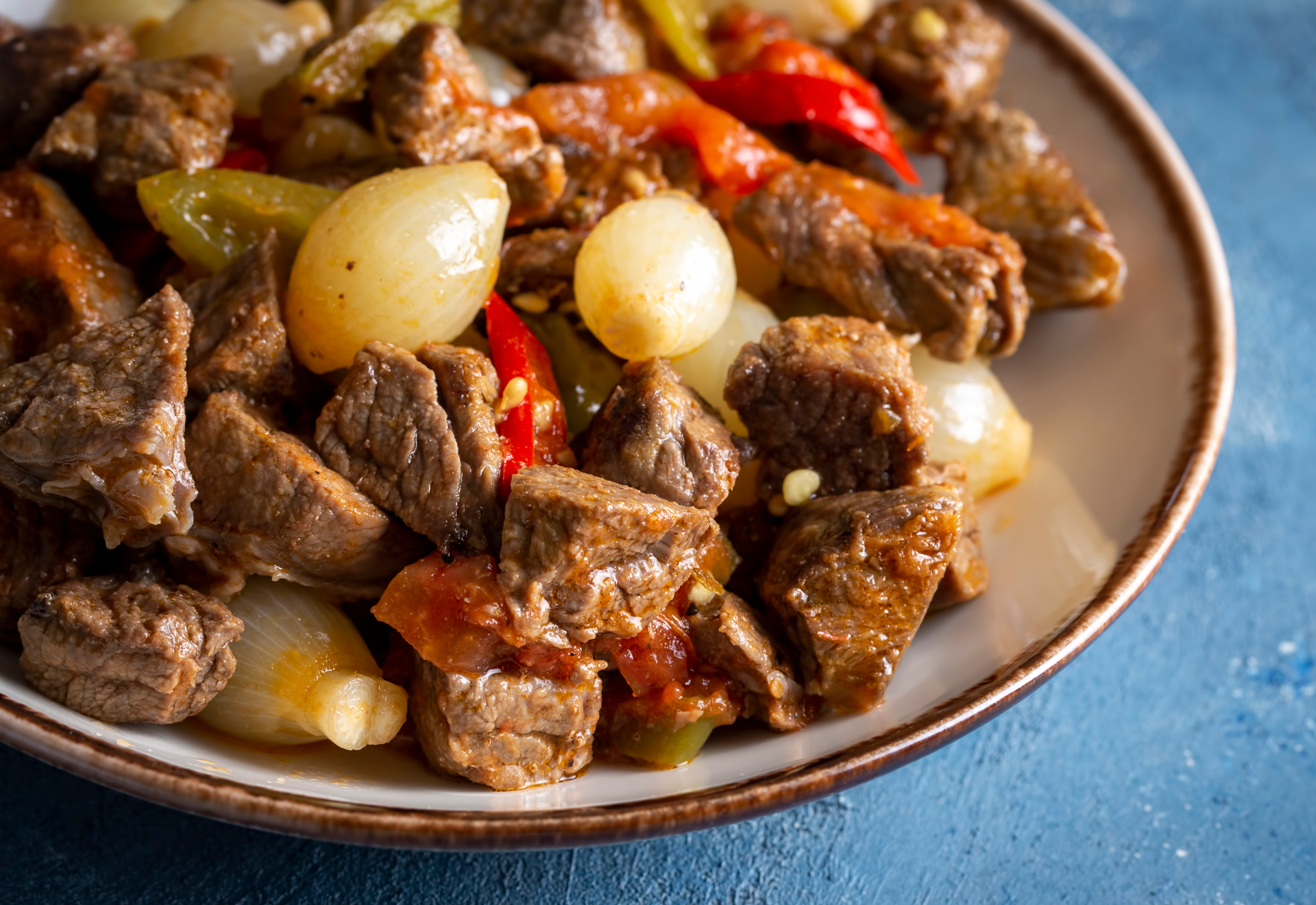 Ethiopian Coffee-Infused Beef Tips with Caramelized Onions — Main Course served and photographed from above