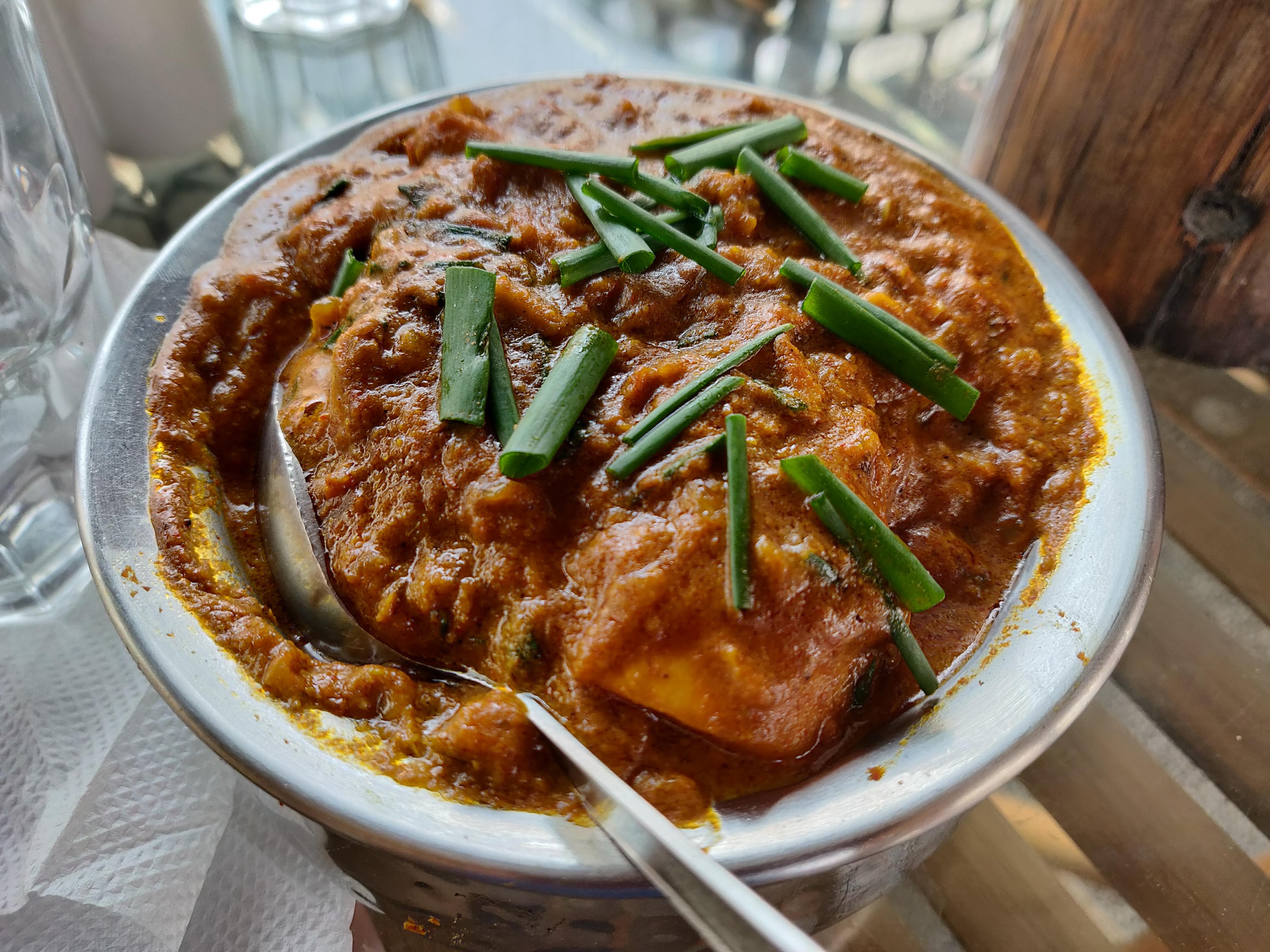 Overhead flat-lay of all ingredients for Ethiopian Doro Alicha with Mild Cumin Sauce laid out on a kitchen surface.